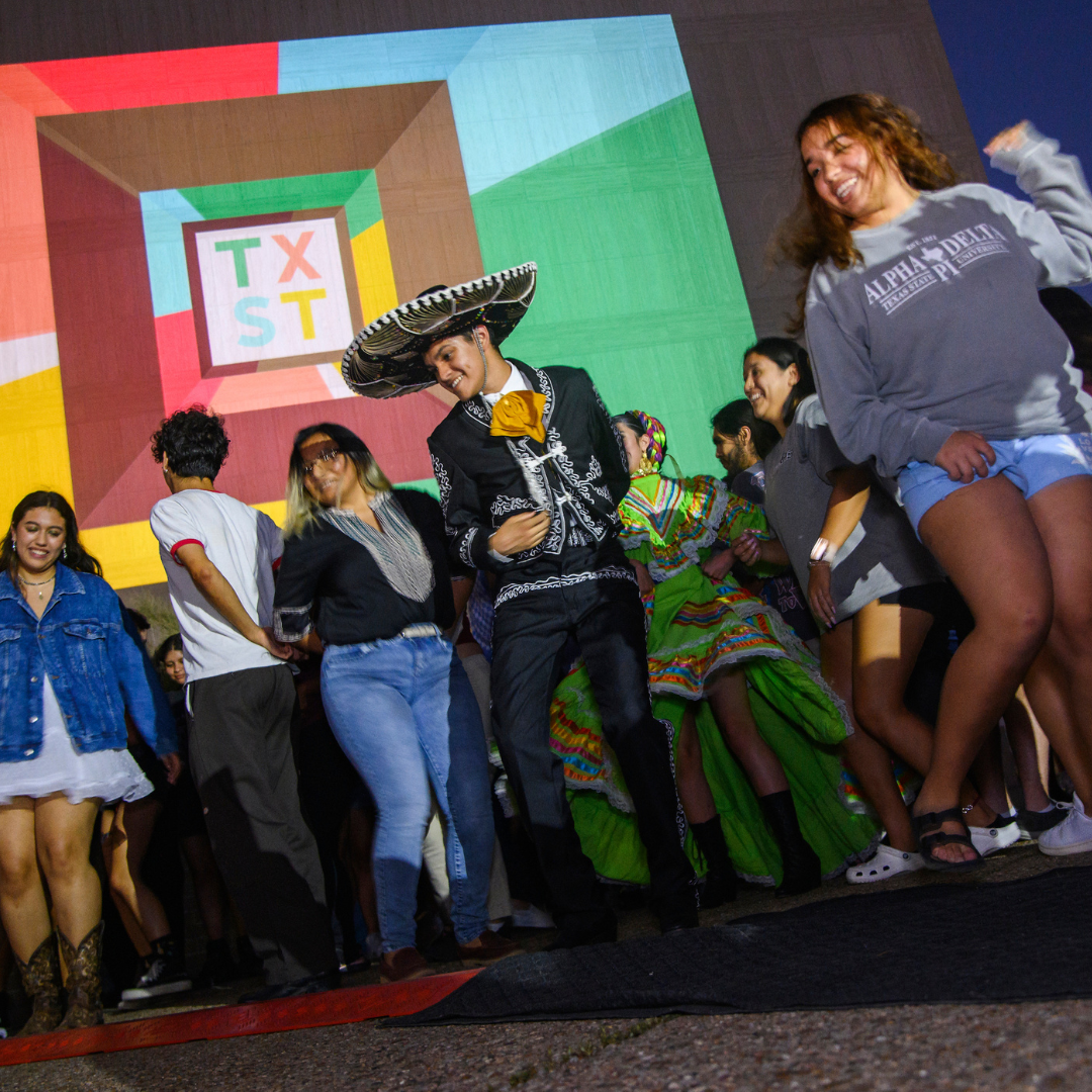 TXST students dancing at an event during Hispanic Heritage Institution Week with Grupo Folklorica. Link: hsi.txst.edu