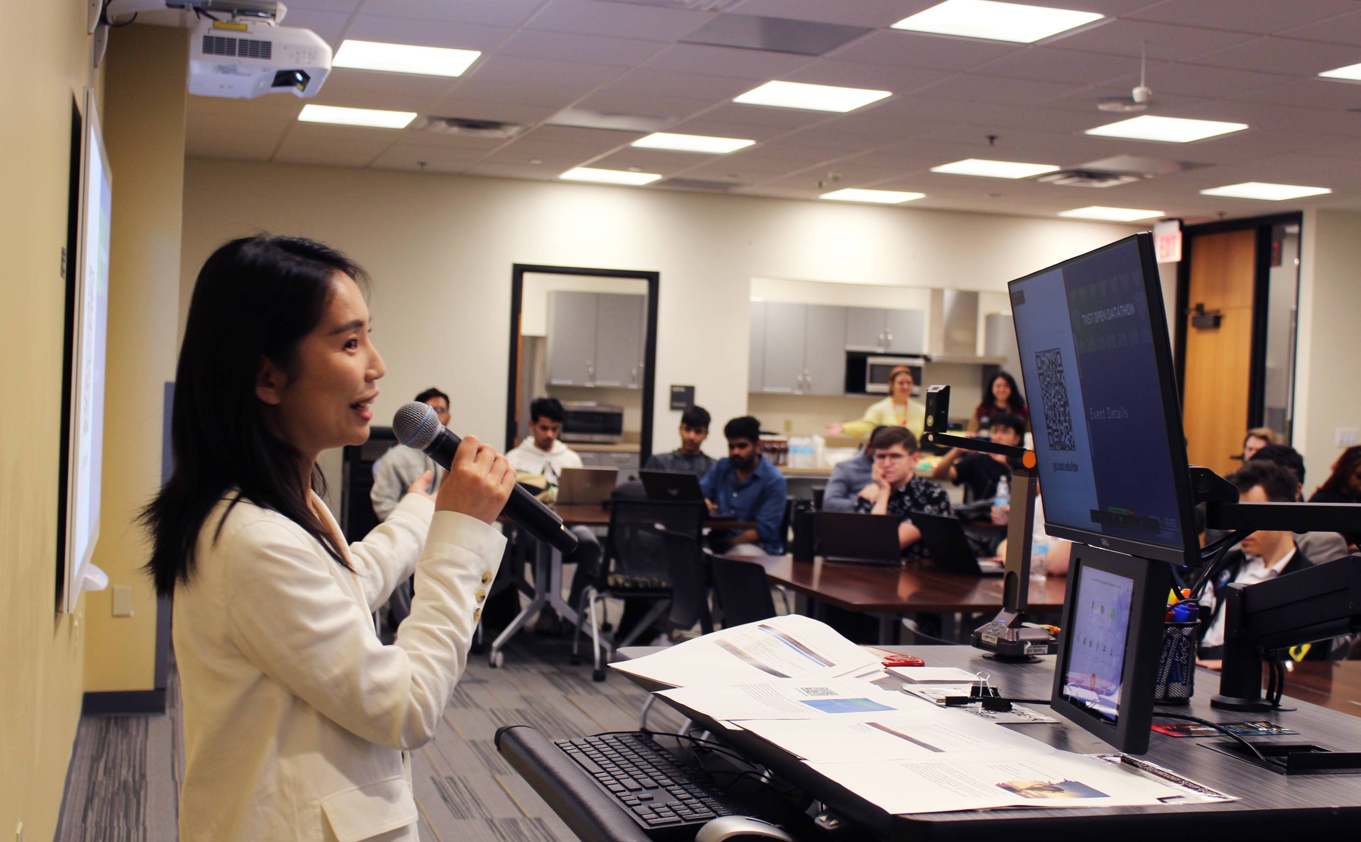 Presenter speaking to group of students