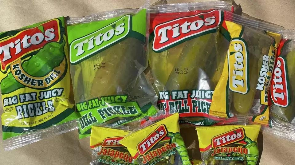 A variety of packaged Tito's pickles.