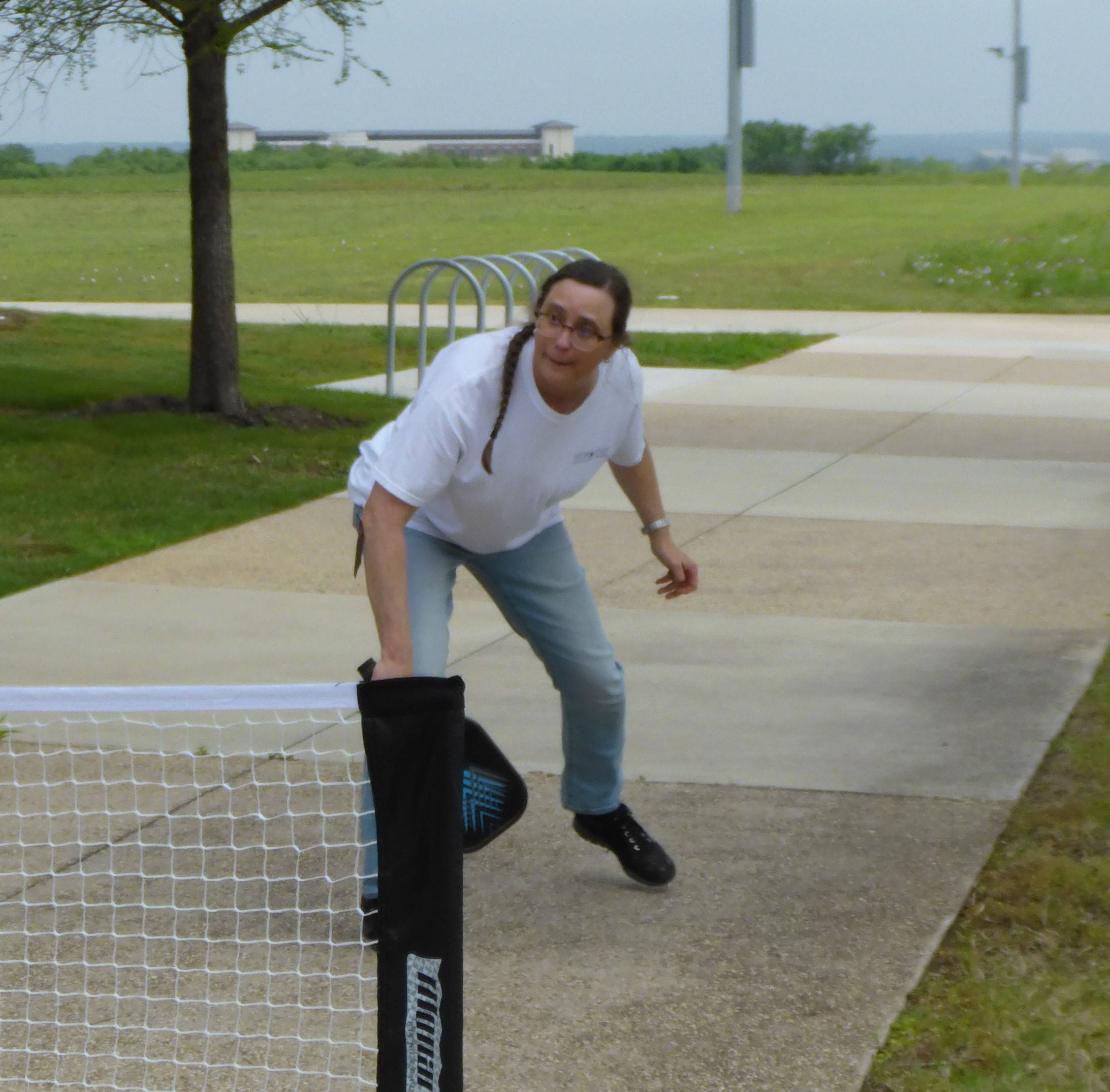 Dr. Schwarz playing pickleball with students