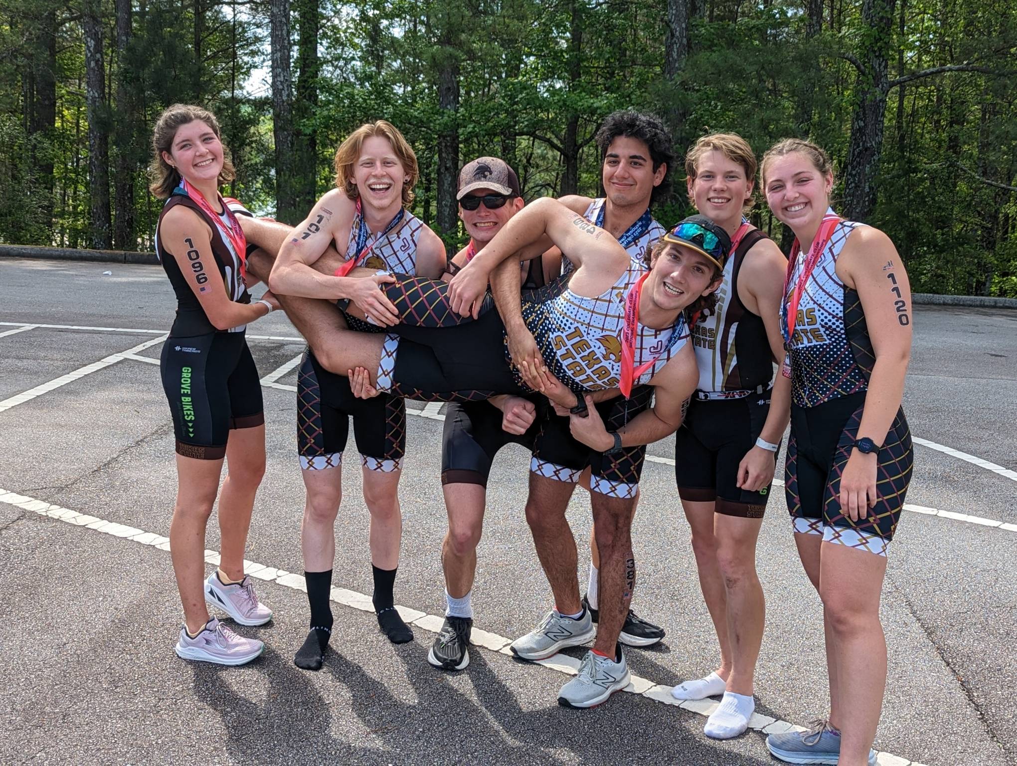 Triathlon sport club celebrating after competition