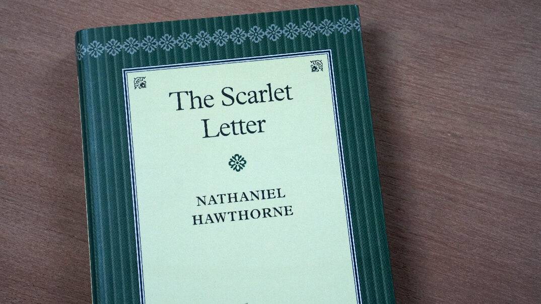 A book named the Scarlet Letter by Nathaniel Hawthorne