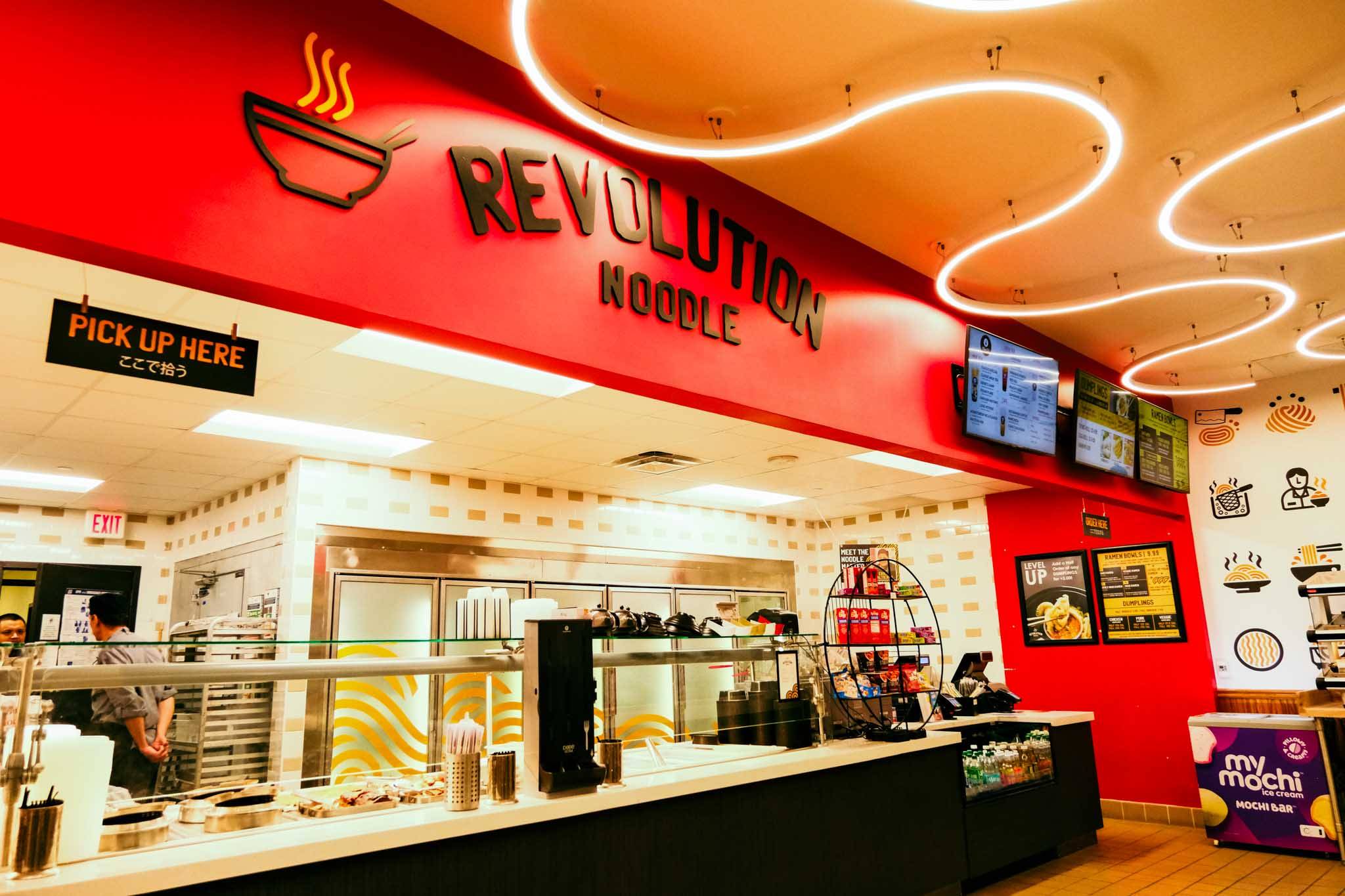 A photo of revolution noodle, sign