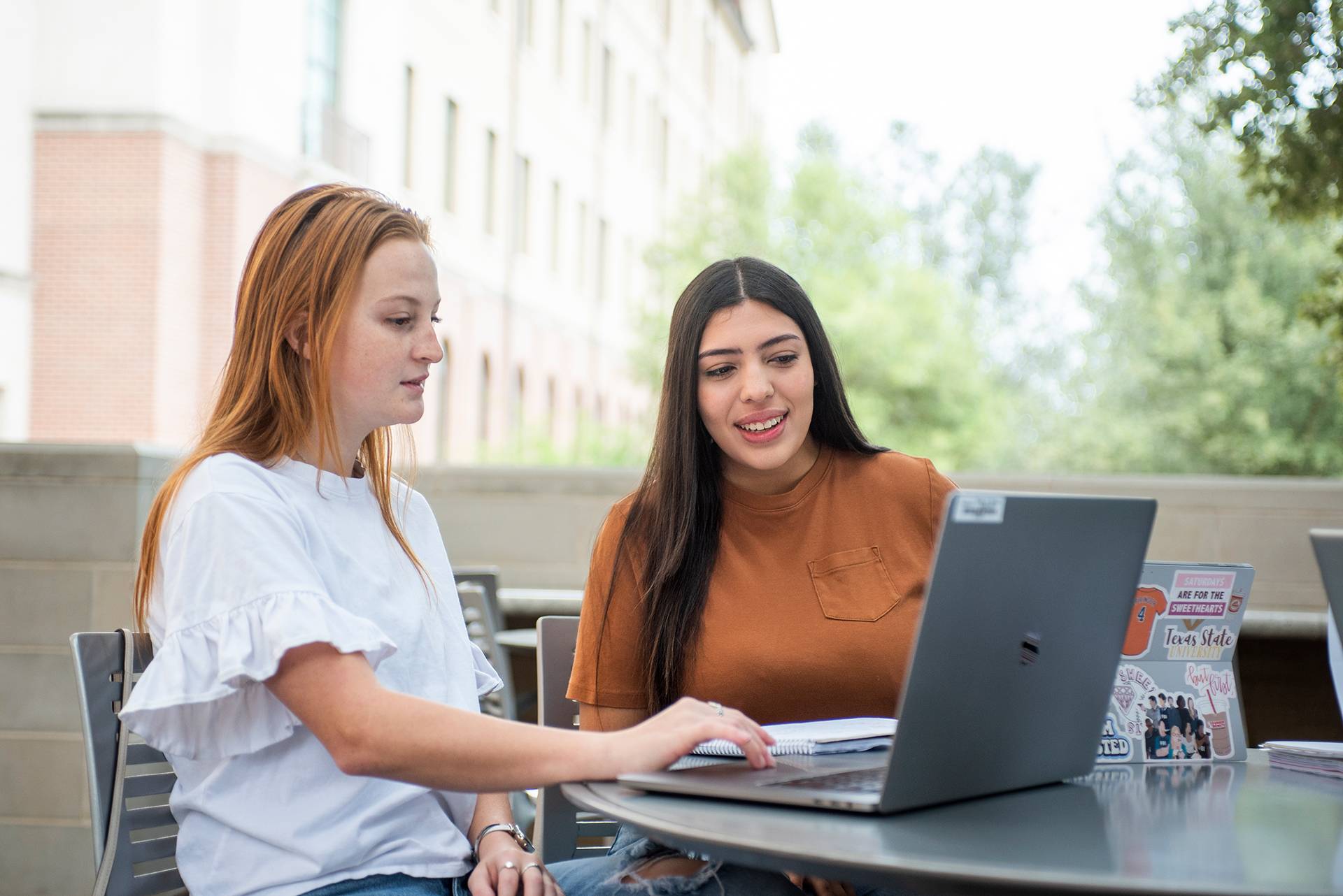 students looking at a laptop