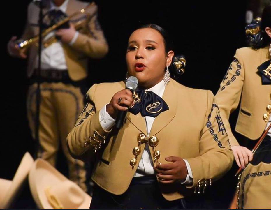 a mariachi band member playing a violin