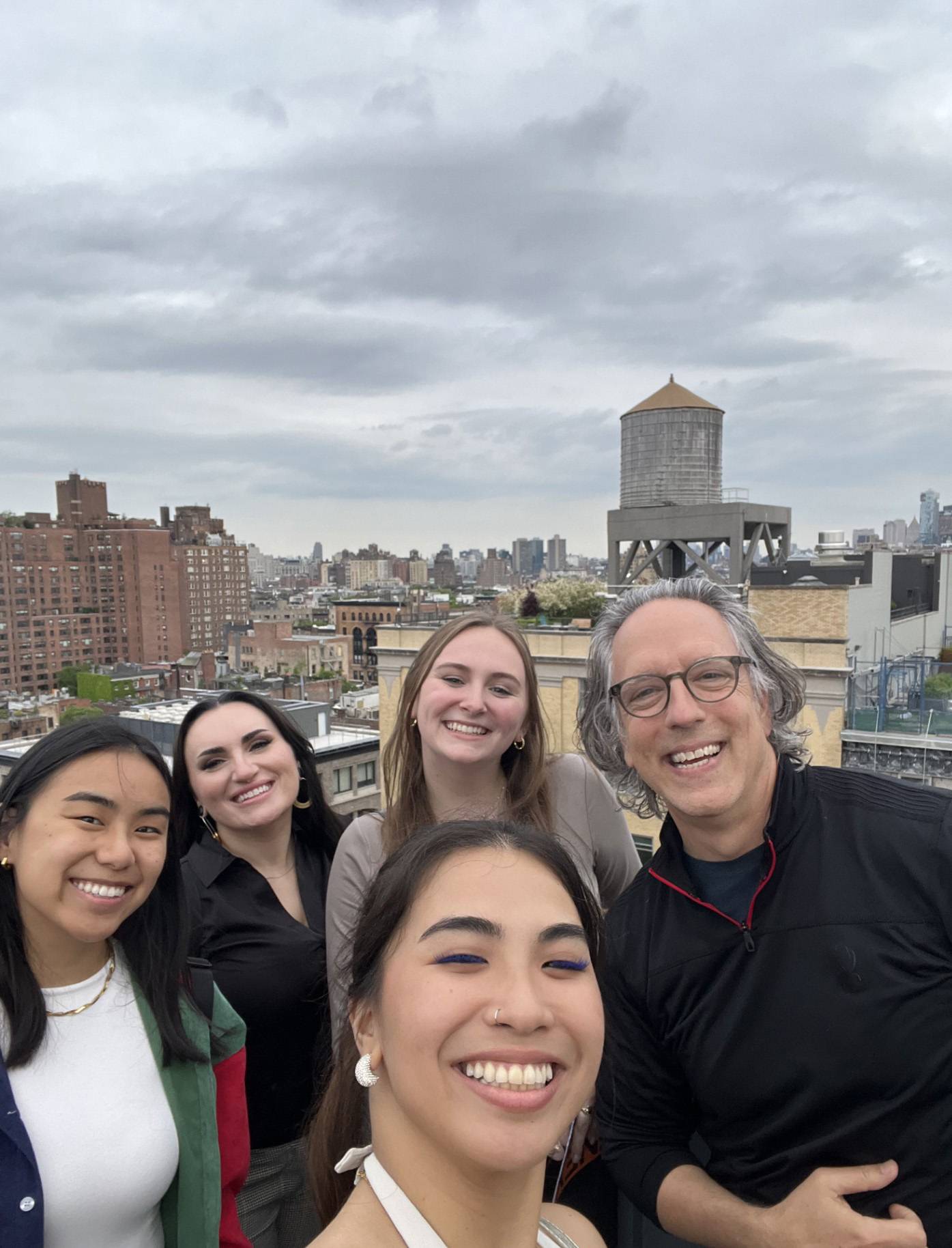 exterior group of students on top of the whitney museum of american art