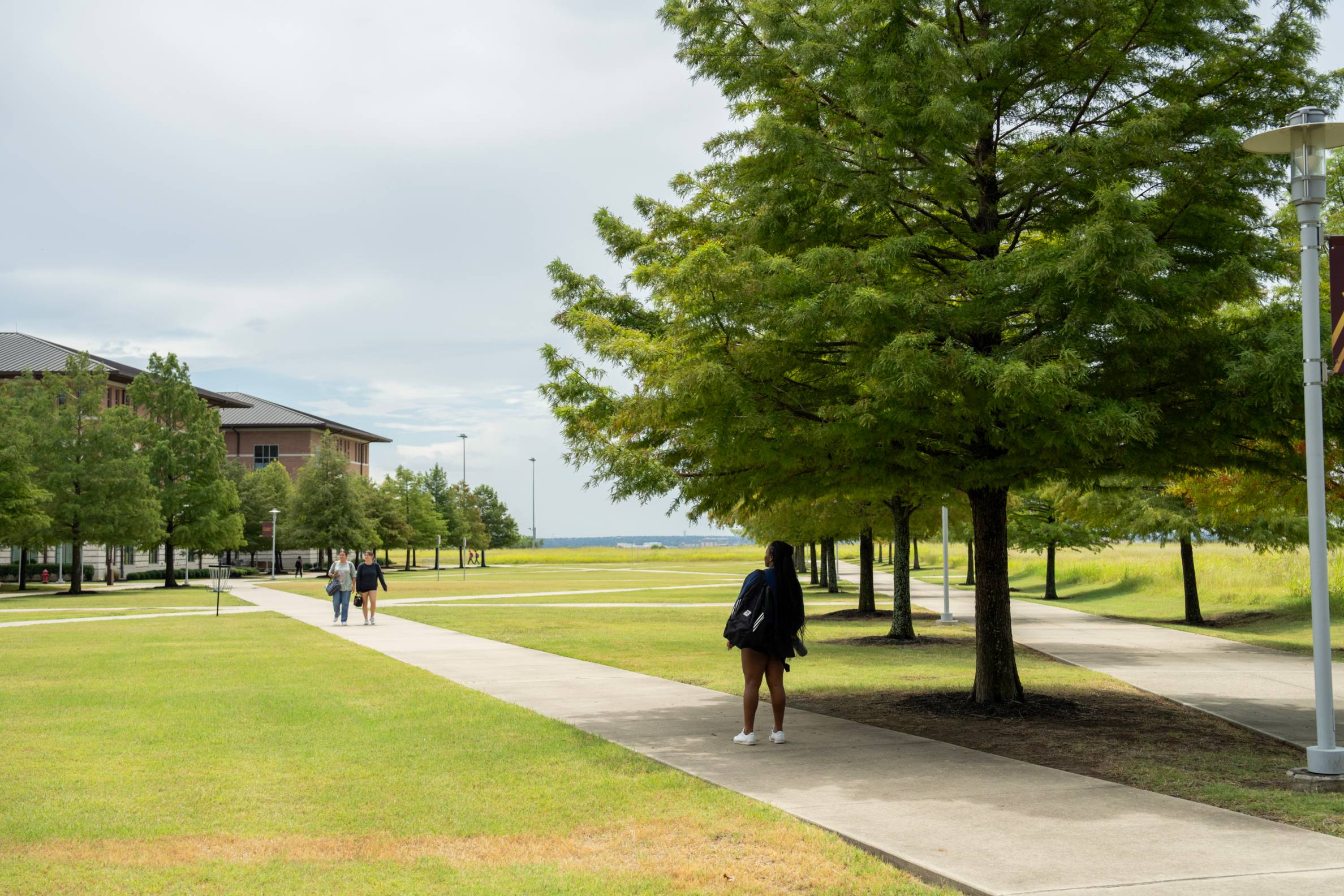 Student walking on campus.