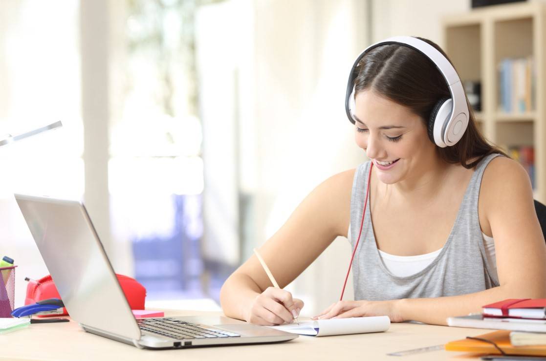 Student smiling at a student off camera