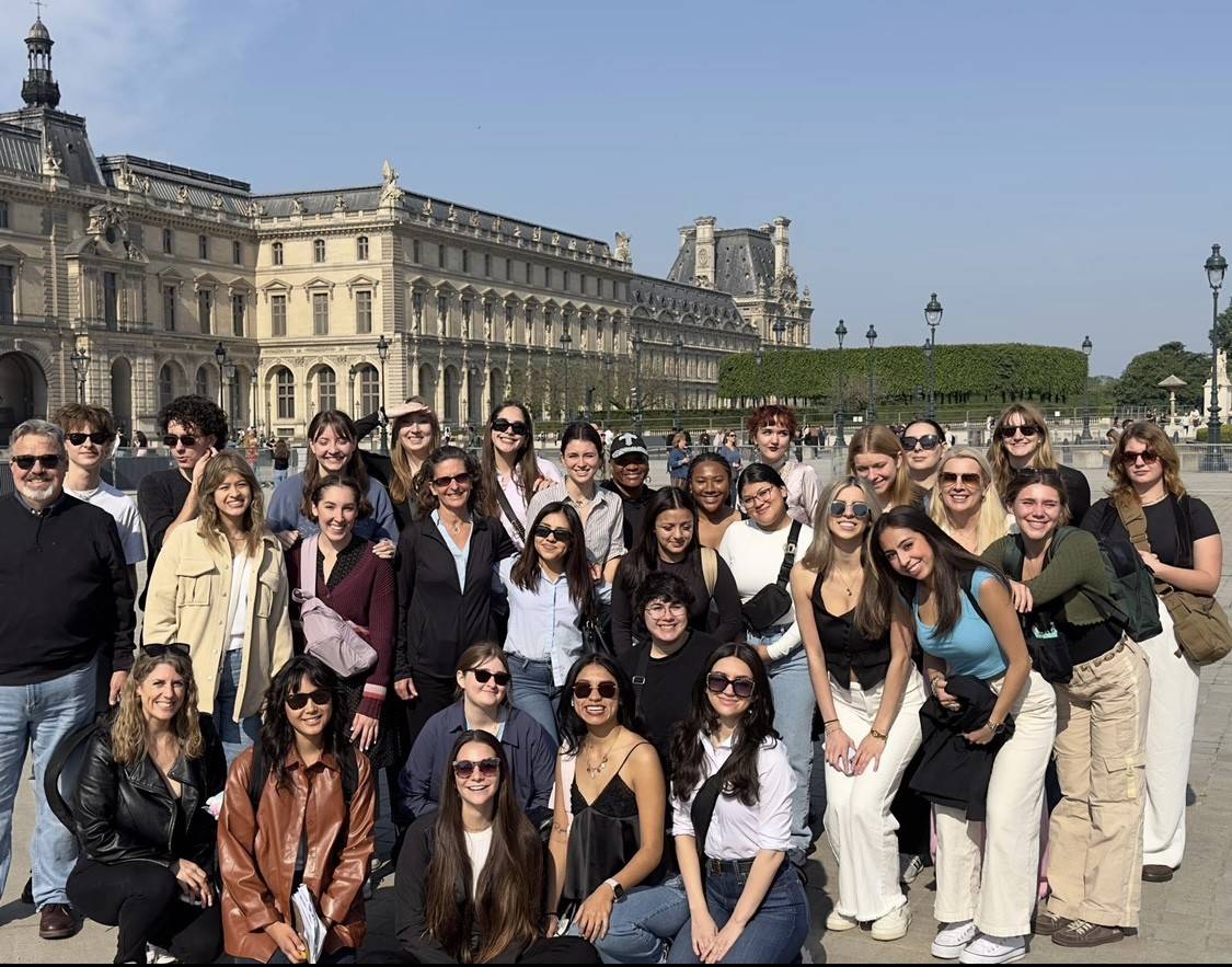 TXST students and faculty standing in front of historical build in London England