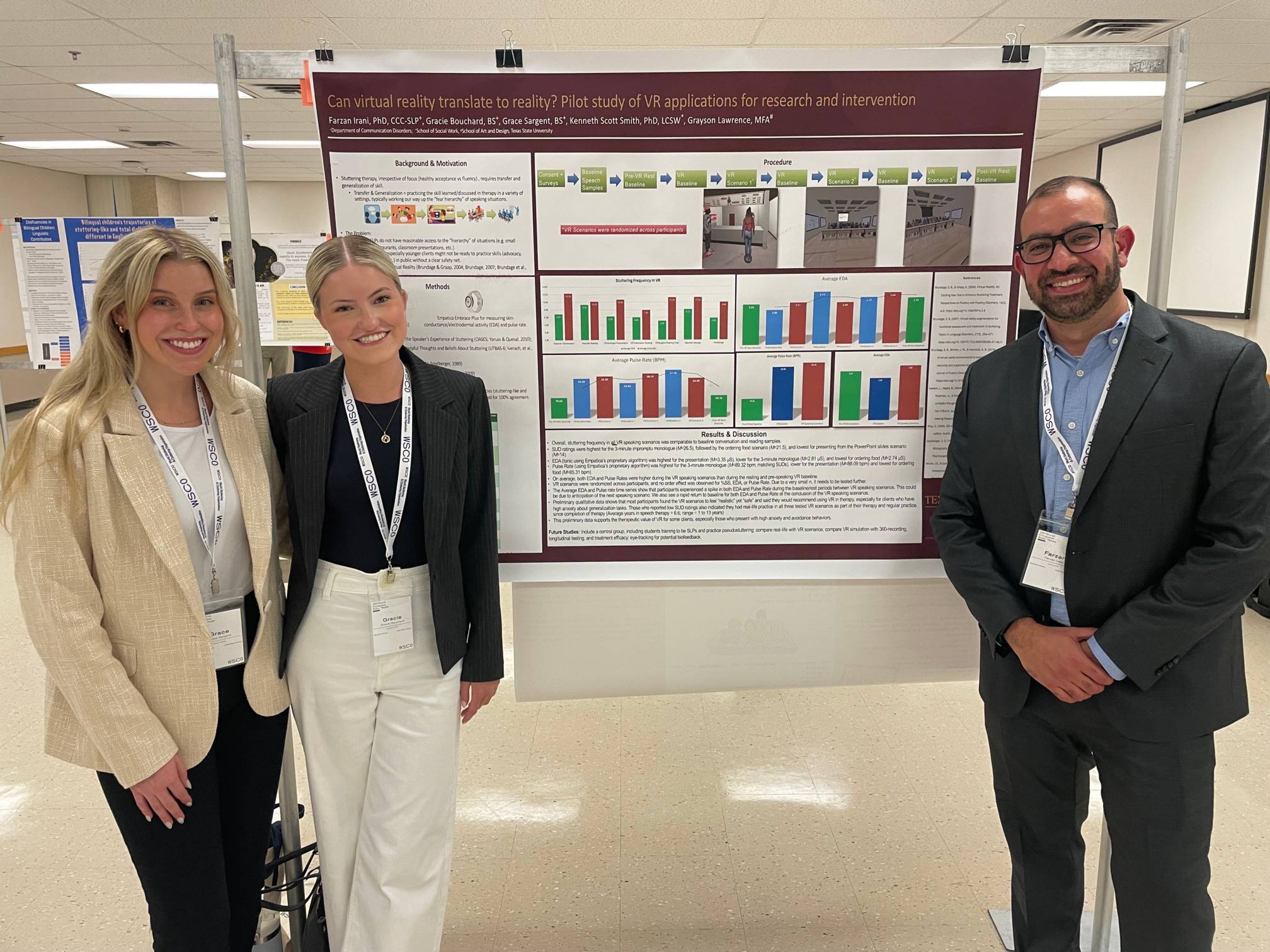 Dr. Irani standing next to CDIS students and their poster.