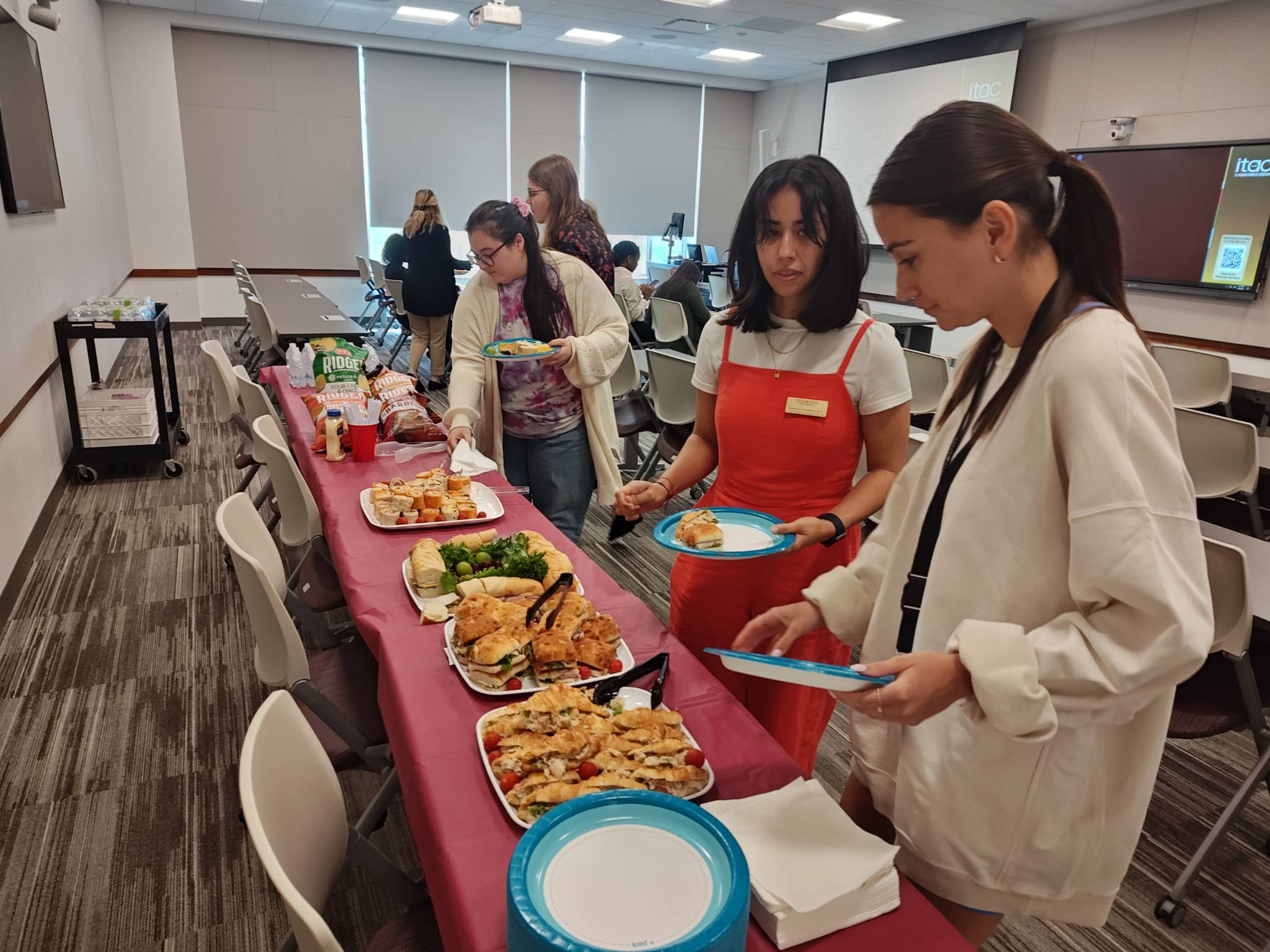 Students enjoying the refreshments during the event.