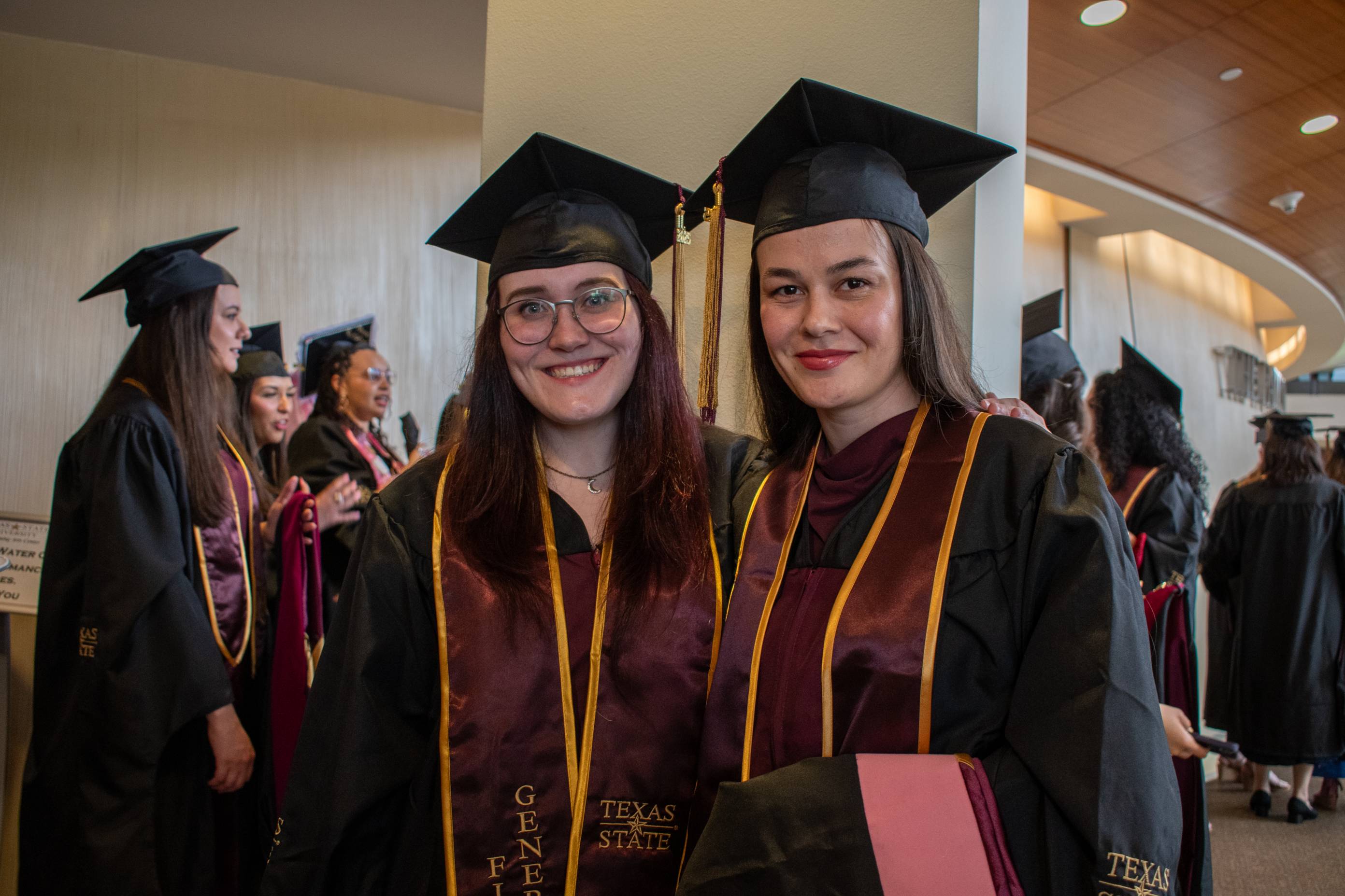 Two masters students posting for a photo