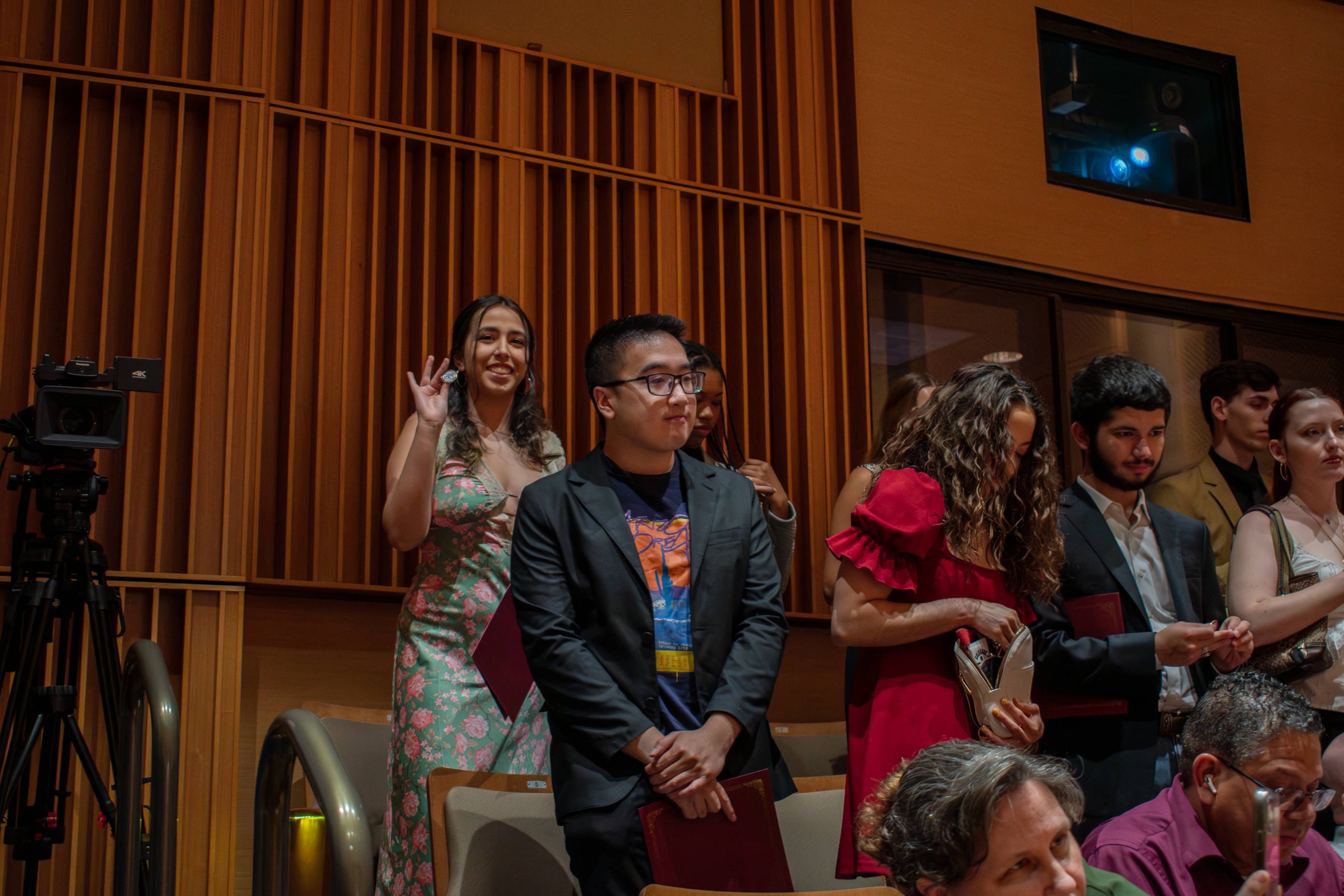 Michael Nibblit shaking hands with a Council of Scholars recipient