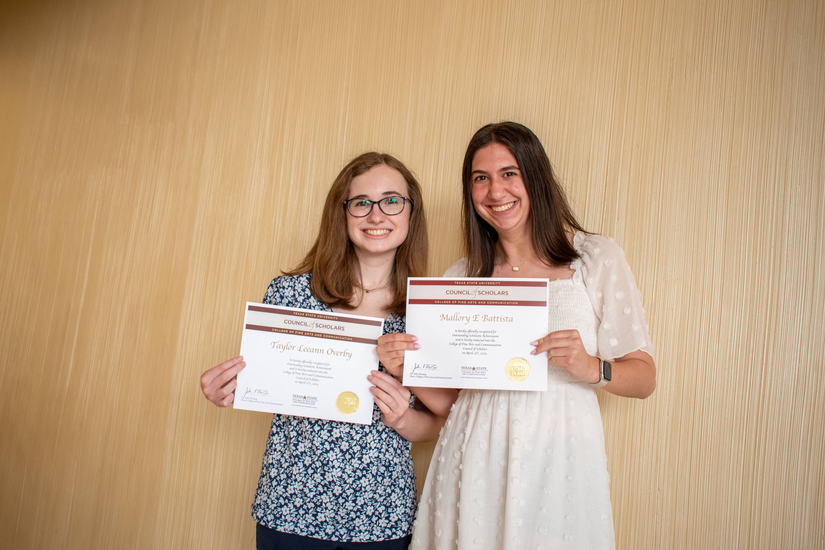 Debbie Alley shaking hands Council of Scholars recipient Rachel Winn.
