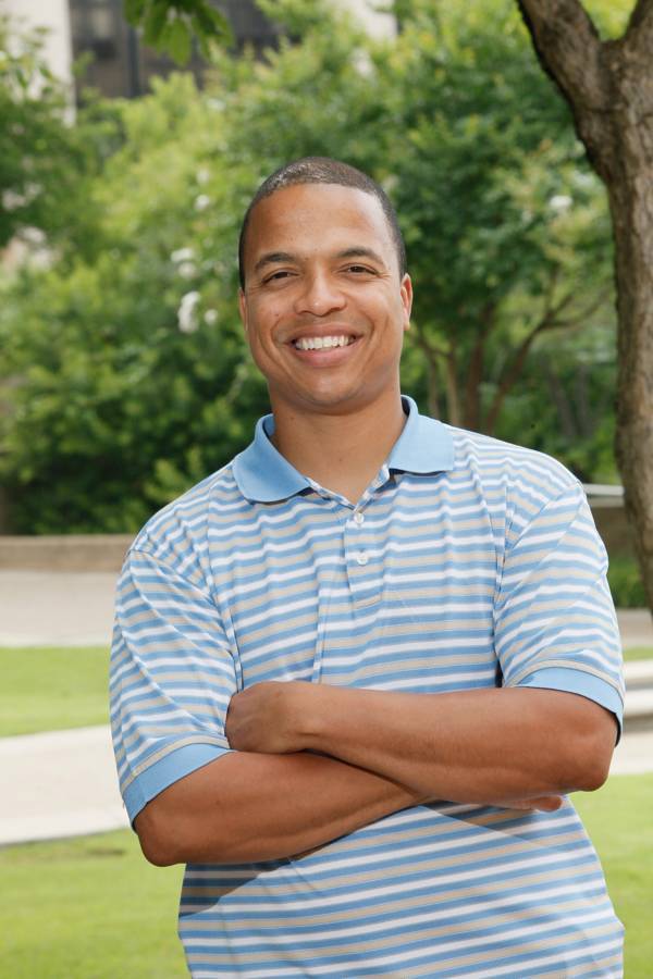 Headshot of Raphael Travis.