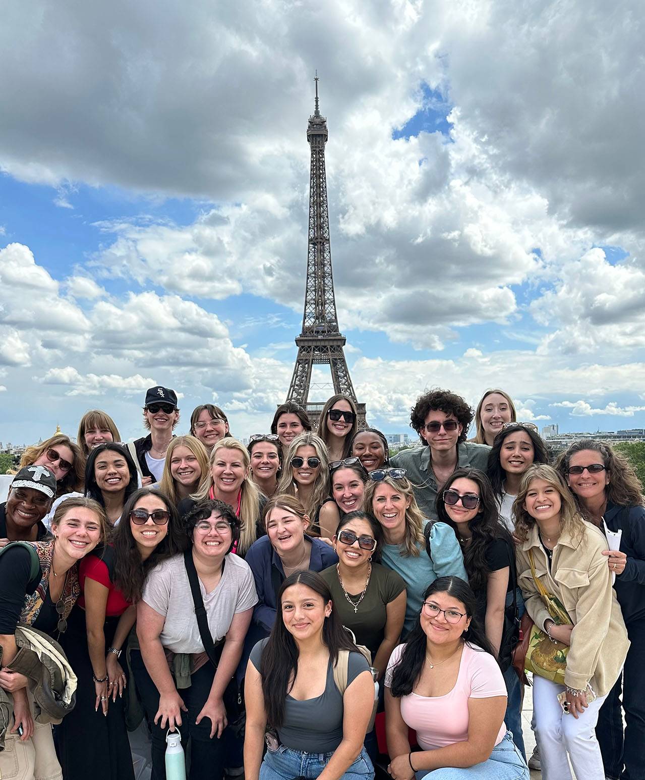 A group of students in a study abroad program pose for a photo in Paris.