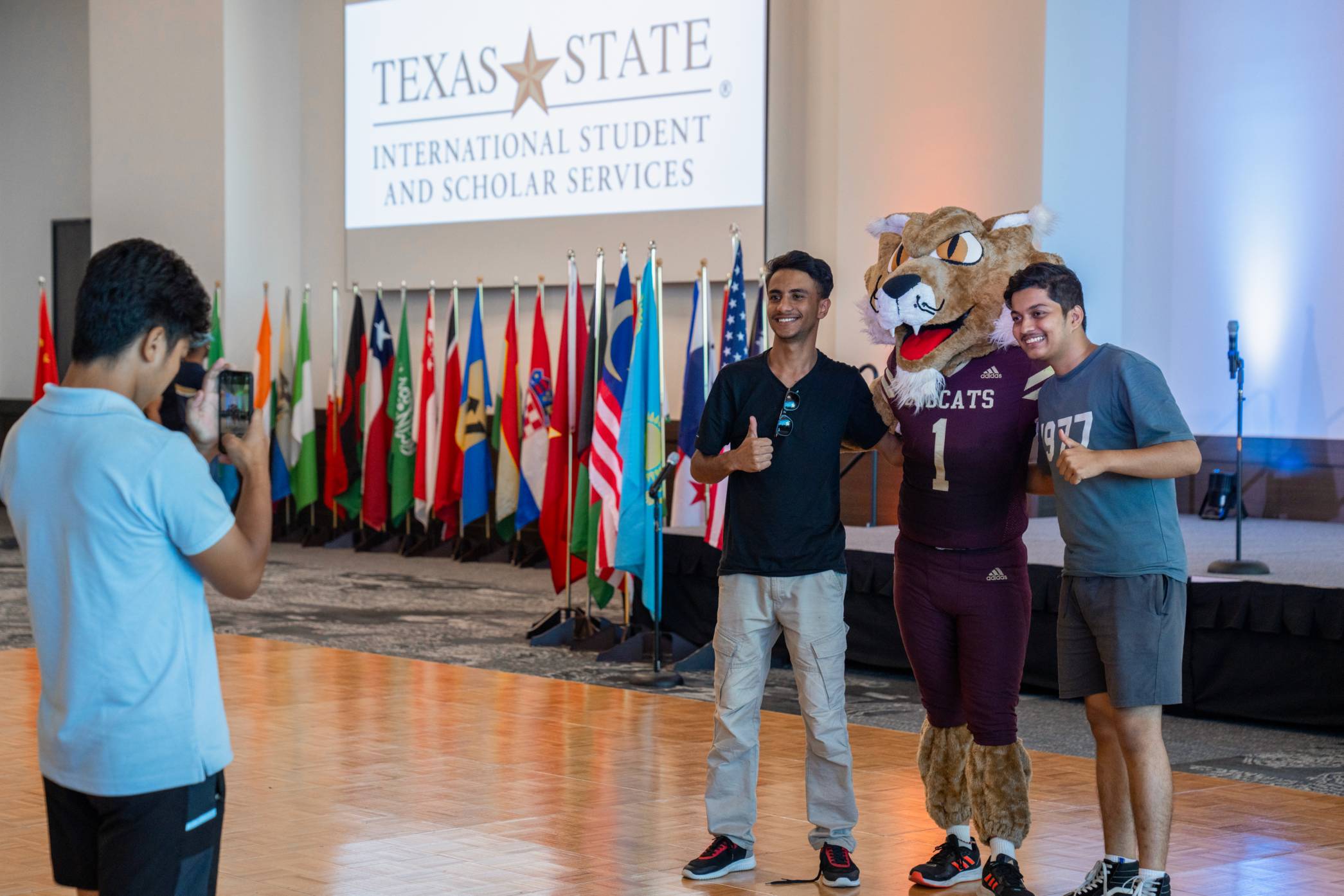 students posing for a group photo at an event