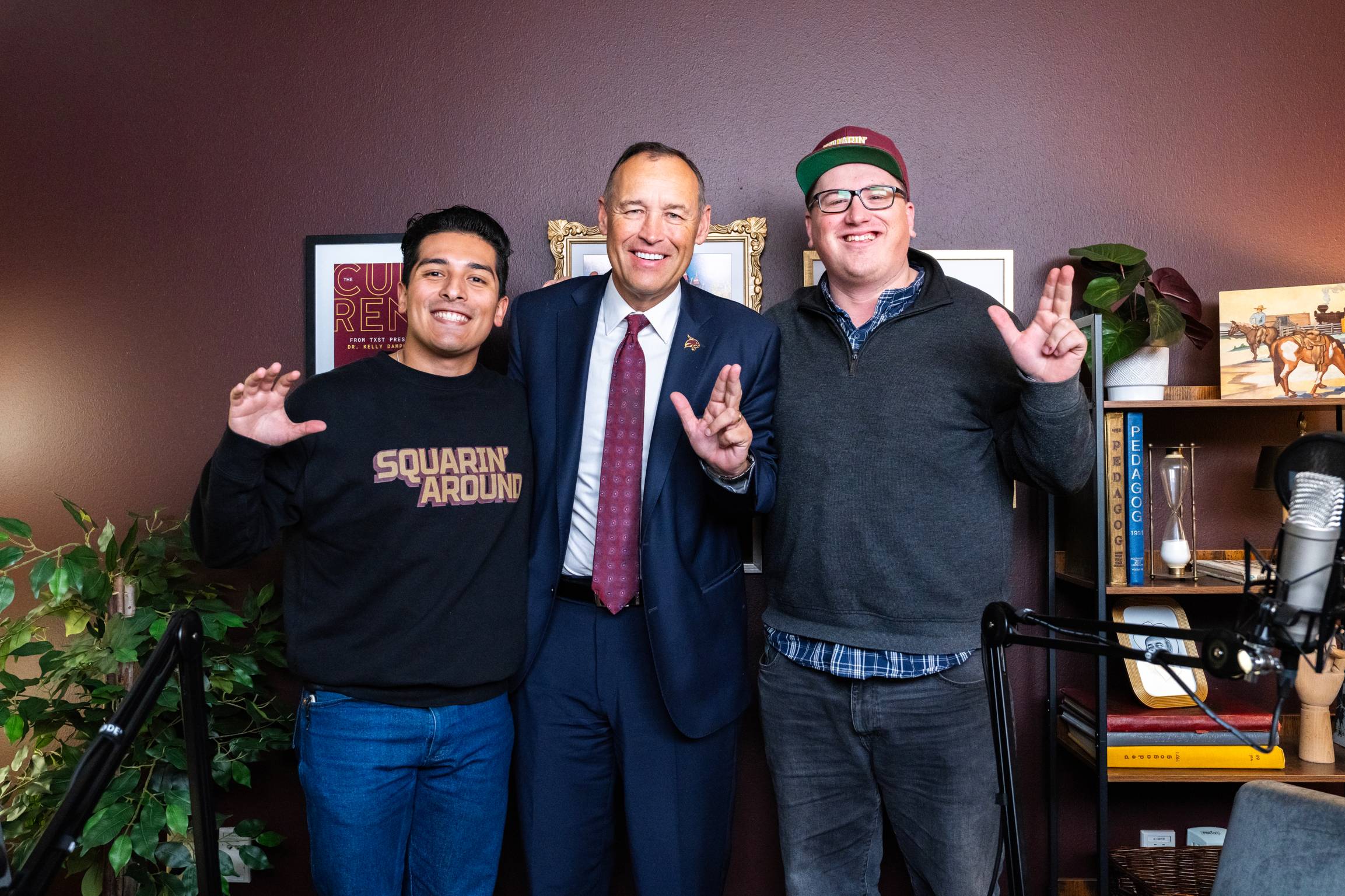 damphousse posing for photo with two men