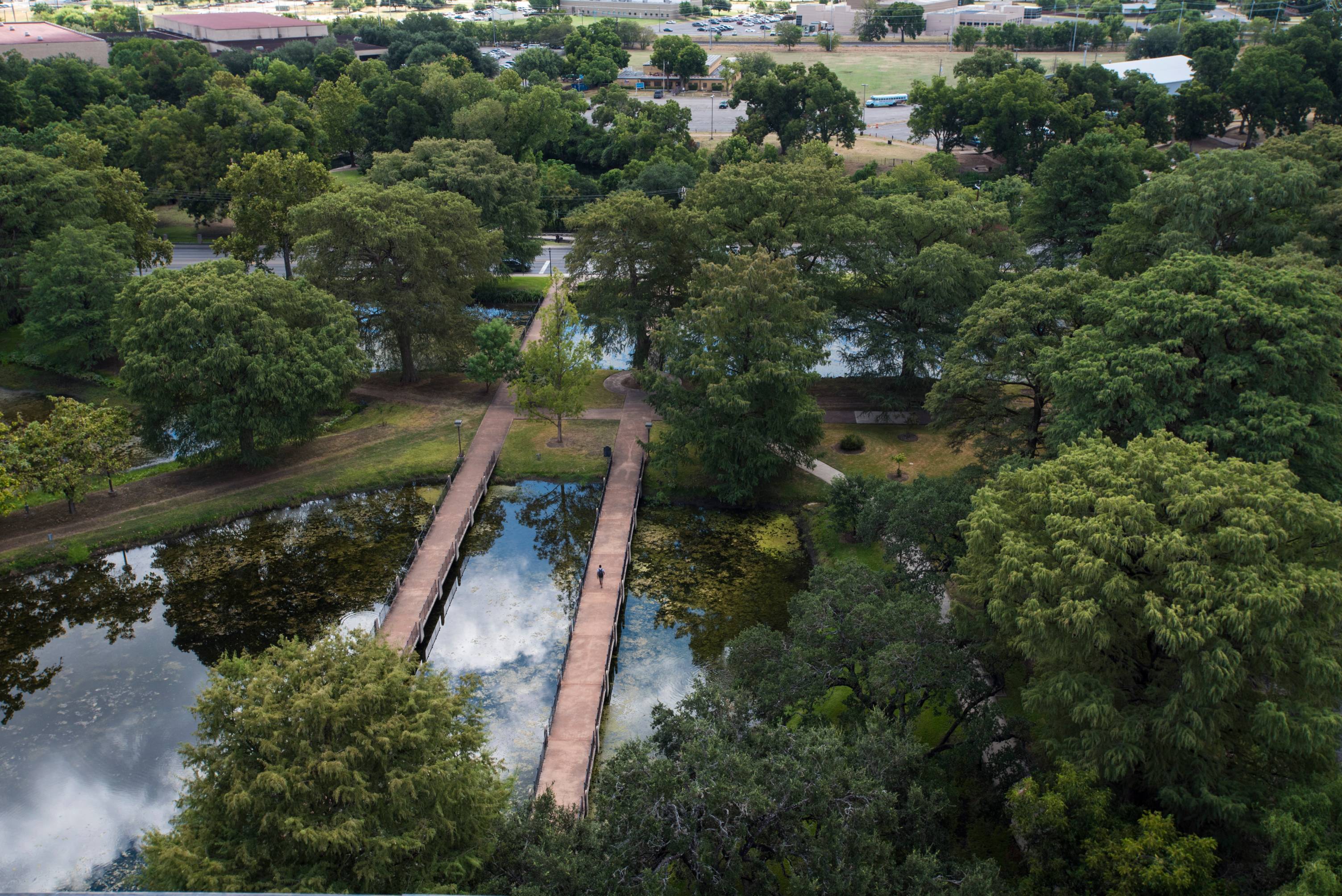 bridges over a pond at texas state university