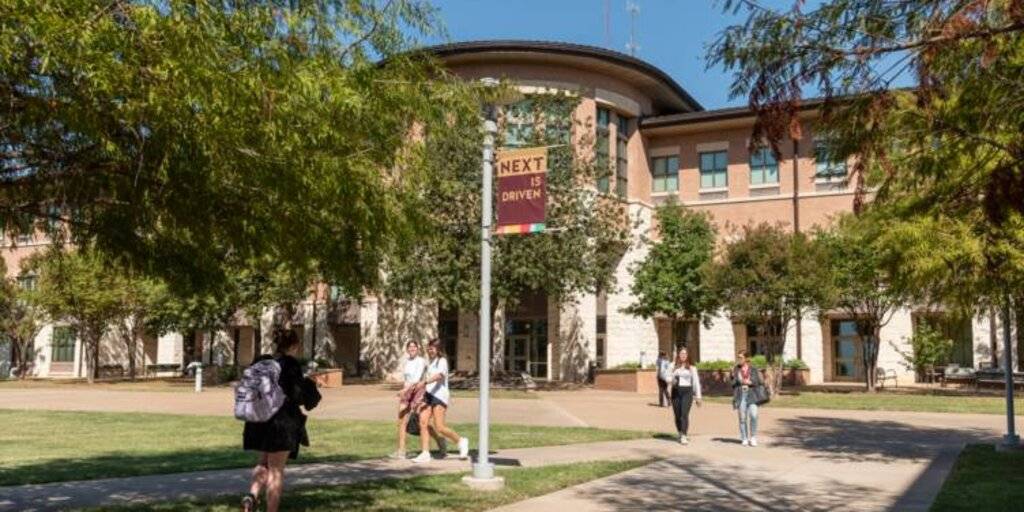 Texas State students walking in front of the Round Rock Texas State campus