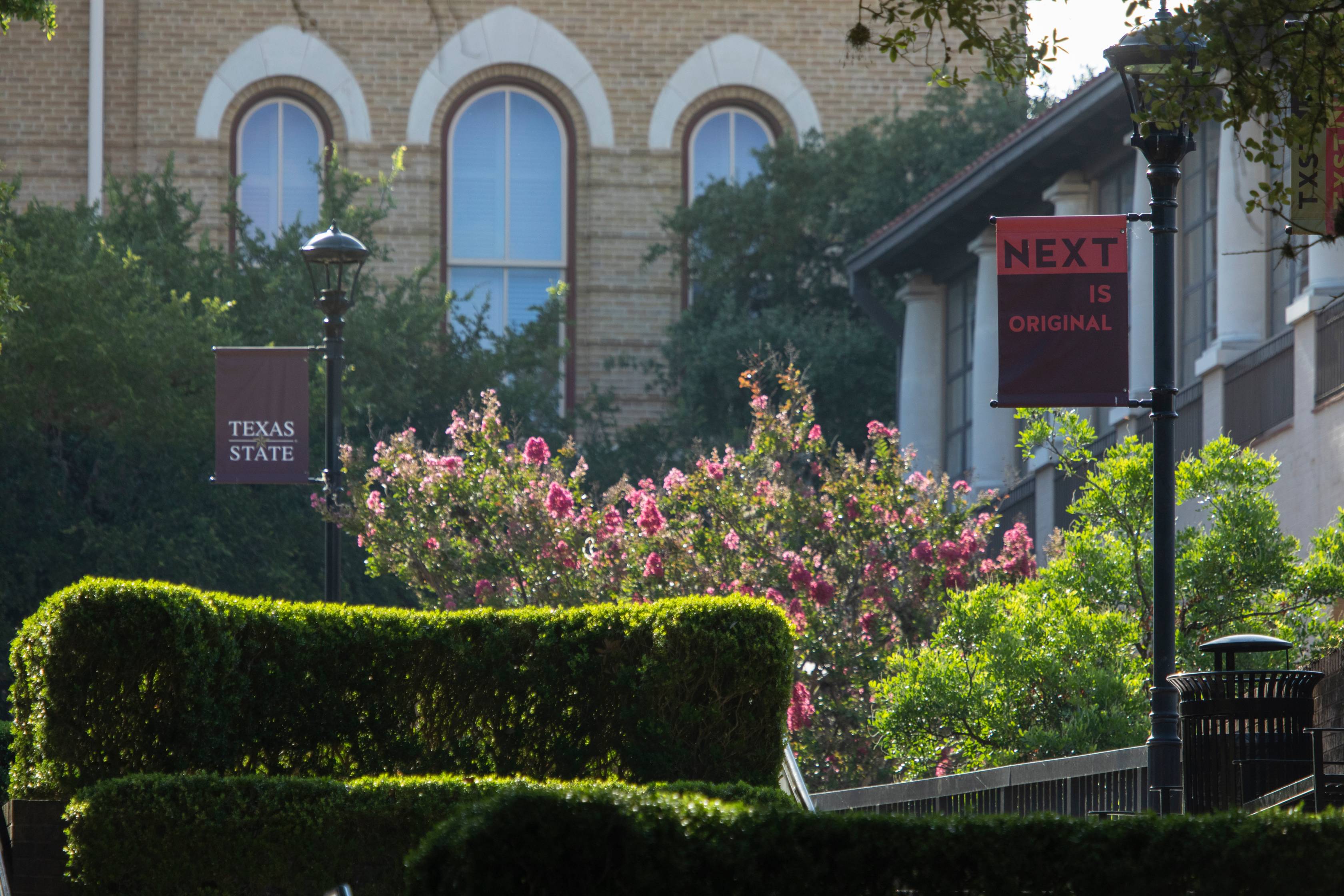 txst next poster outside in front of old main