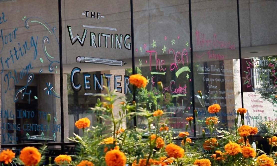 The writing center text on window outside of ASBN Building