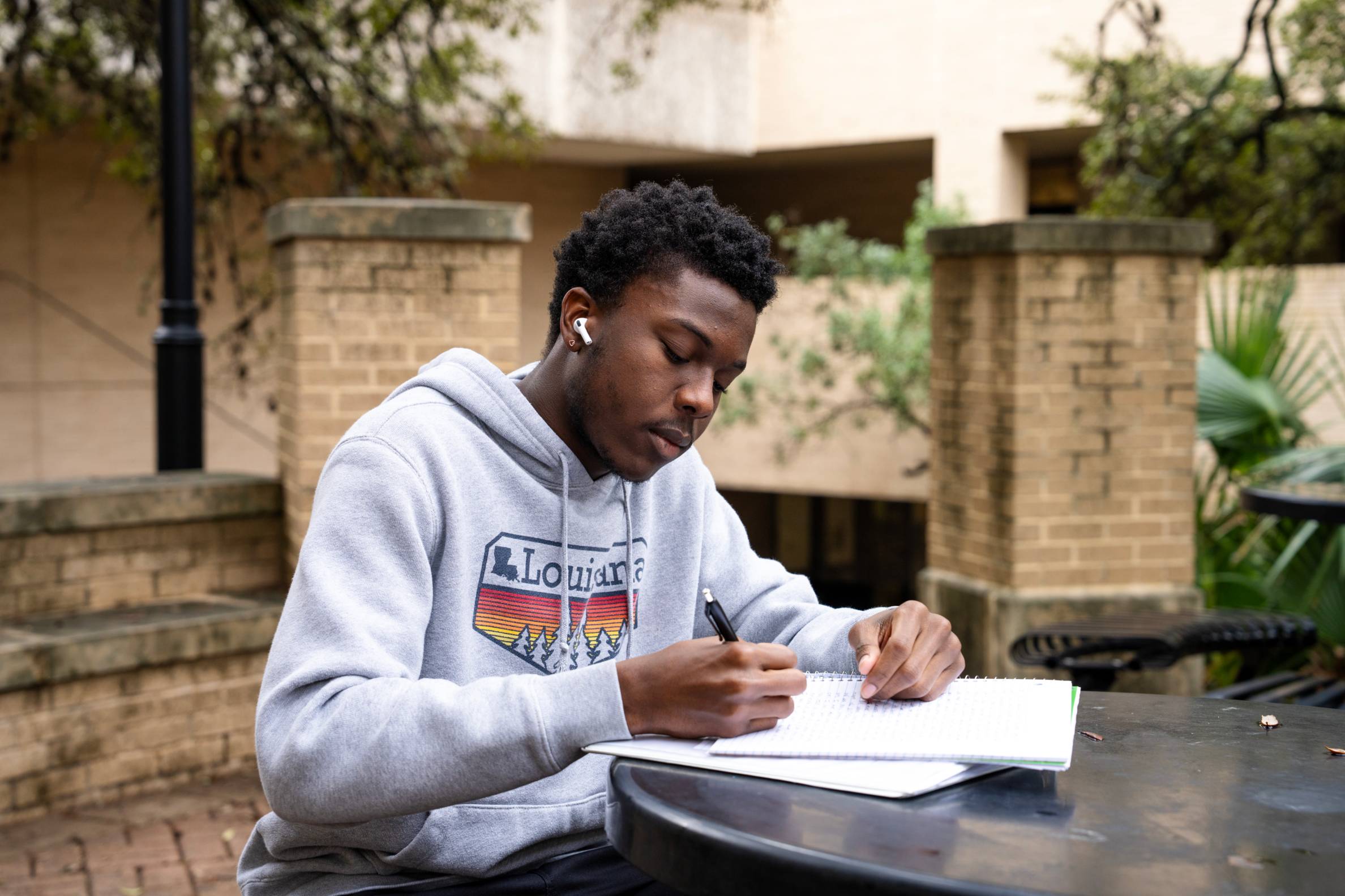 student sitting outside studying