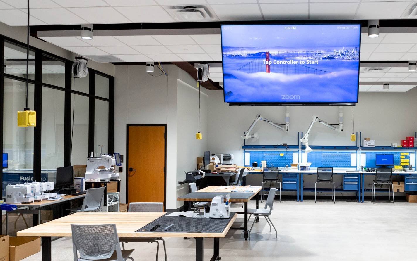room with equipment and a big tv mounted on top