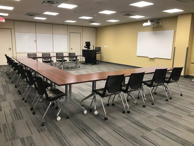 tables and chairs in U shape setup