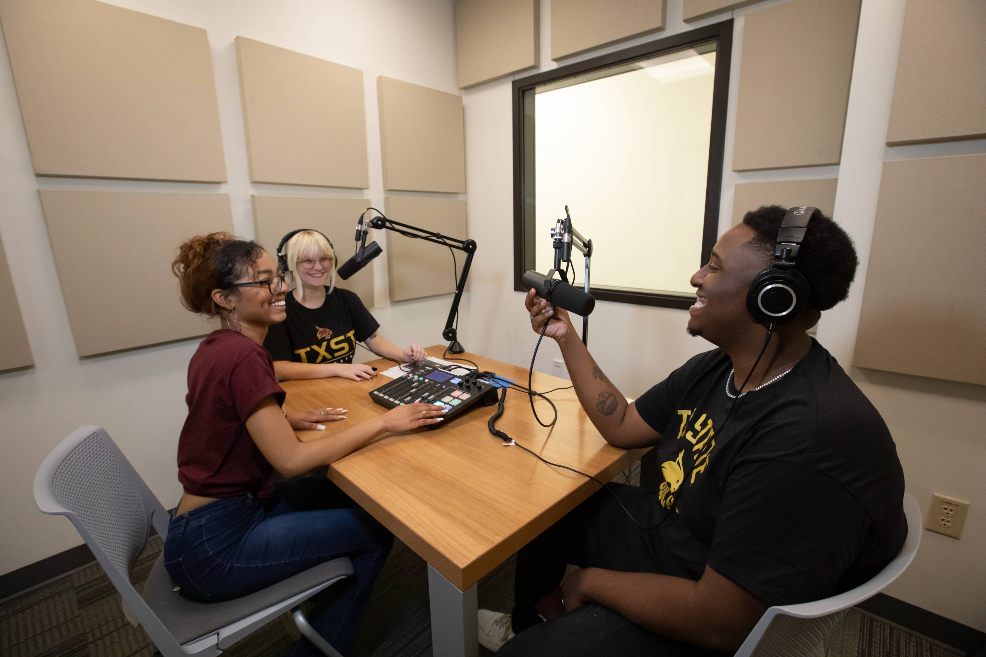 people in a room and doing a podcast
