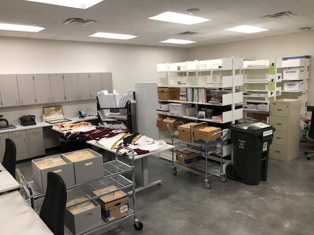 Archivist room with documents, tables and chairs
