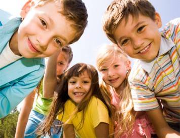 A group of children looking at the camera