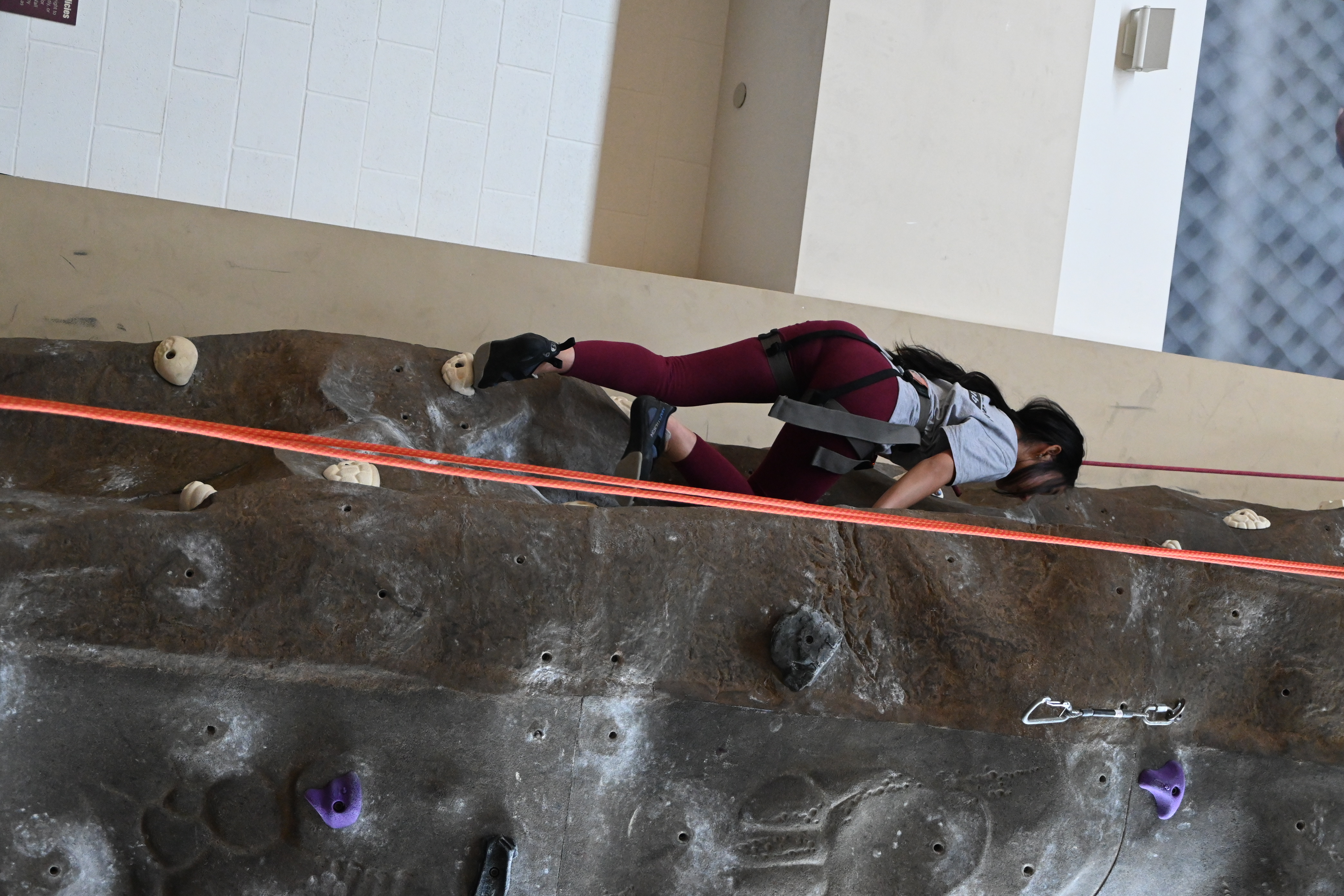 JSMCR girl climbing the rock wall