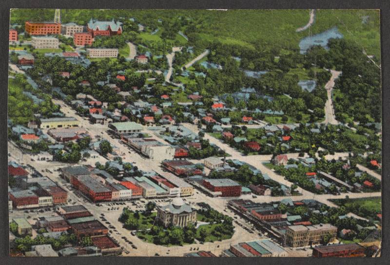 aerial photograph of San Marcos, Texas with the Southwest Texas State University in the background