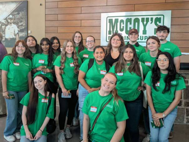 Group of students gather at McCoy Building Supply for a group trip