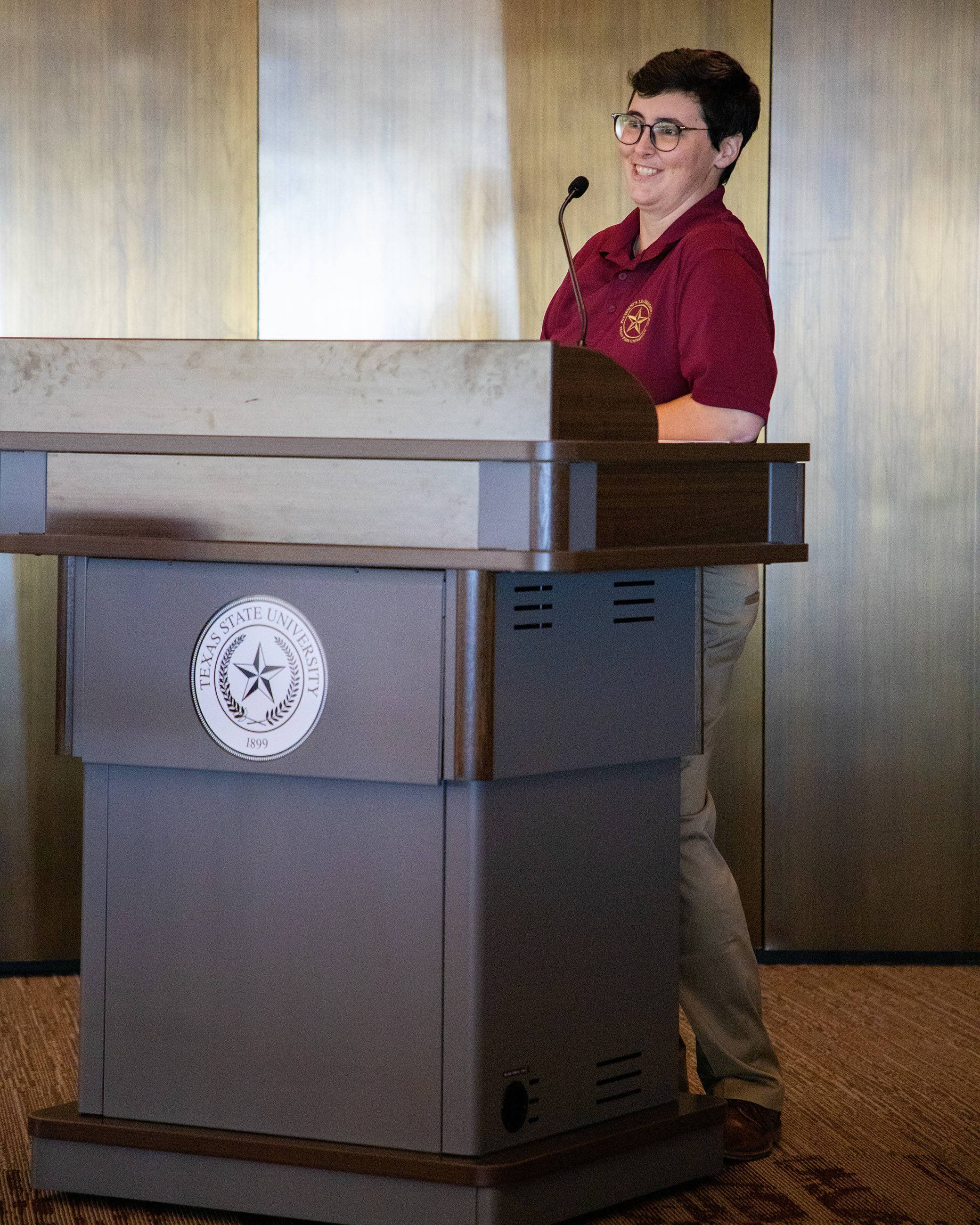 A student speaks to the crowd at the Elevate Employability Summit.