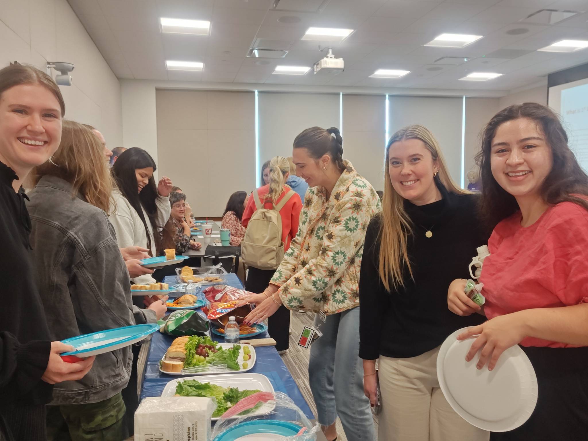 CDIS students in line for the potluck.