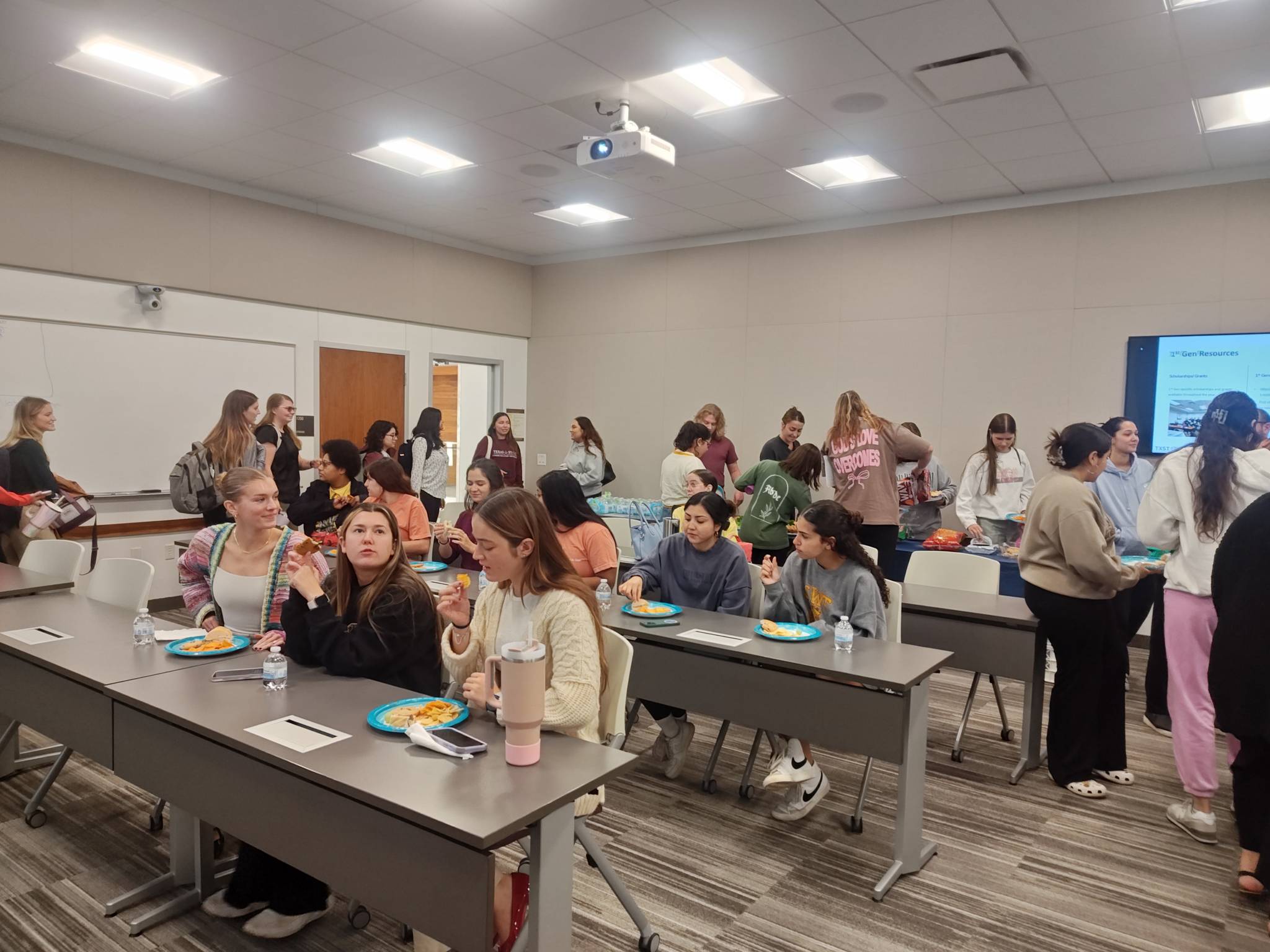 Students and faculty having a conversation