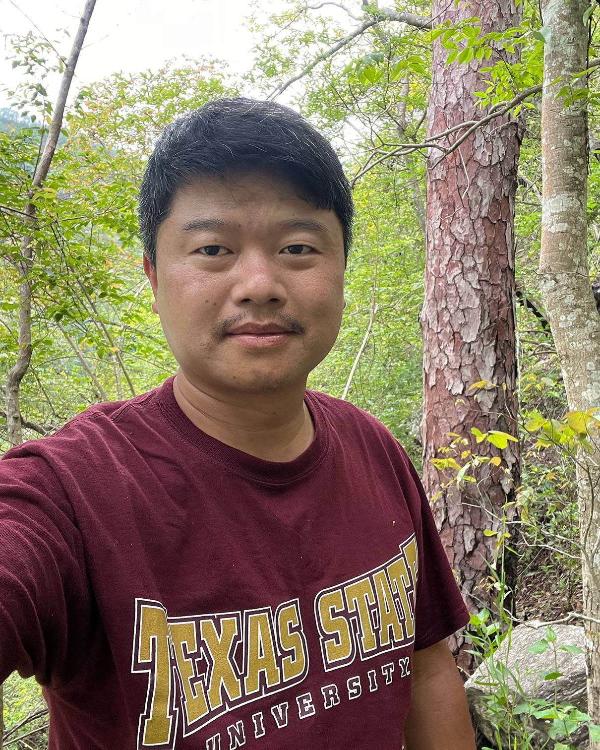 Pema Khandu takes a selfie in the Puntsangchhu river basin beside a large Chir Pine tree, a roosting site for the White-bellied Heron.