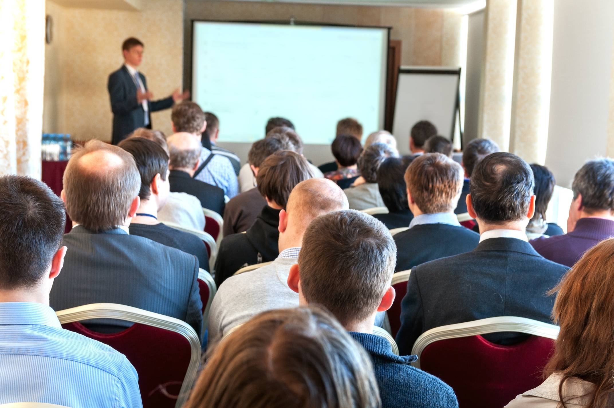 people at a conference presentation