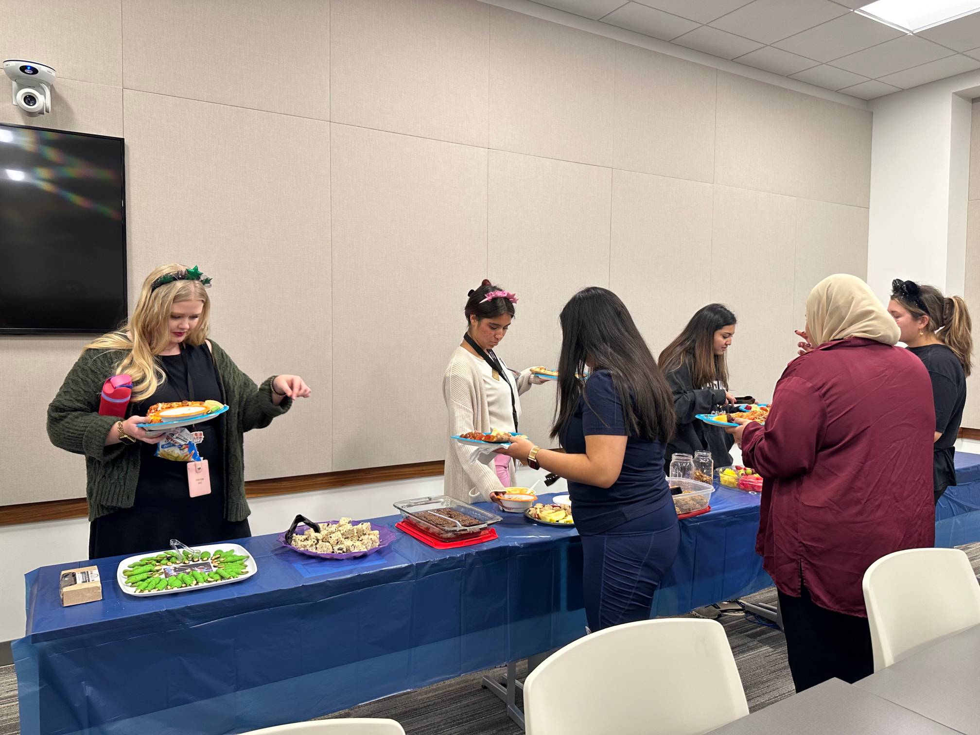 Students enjoying the potluck