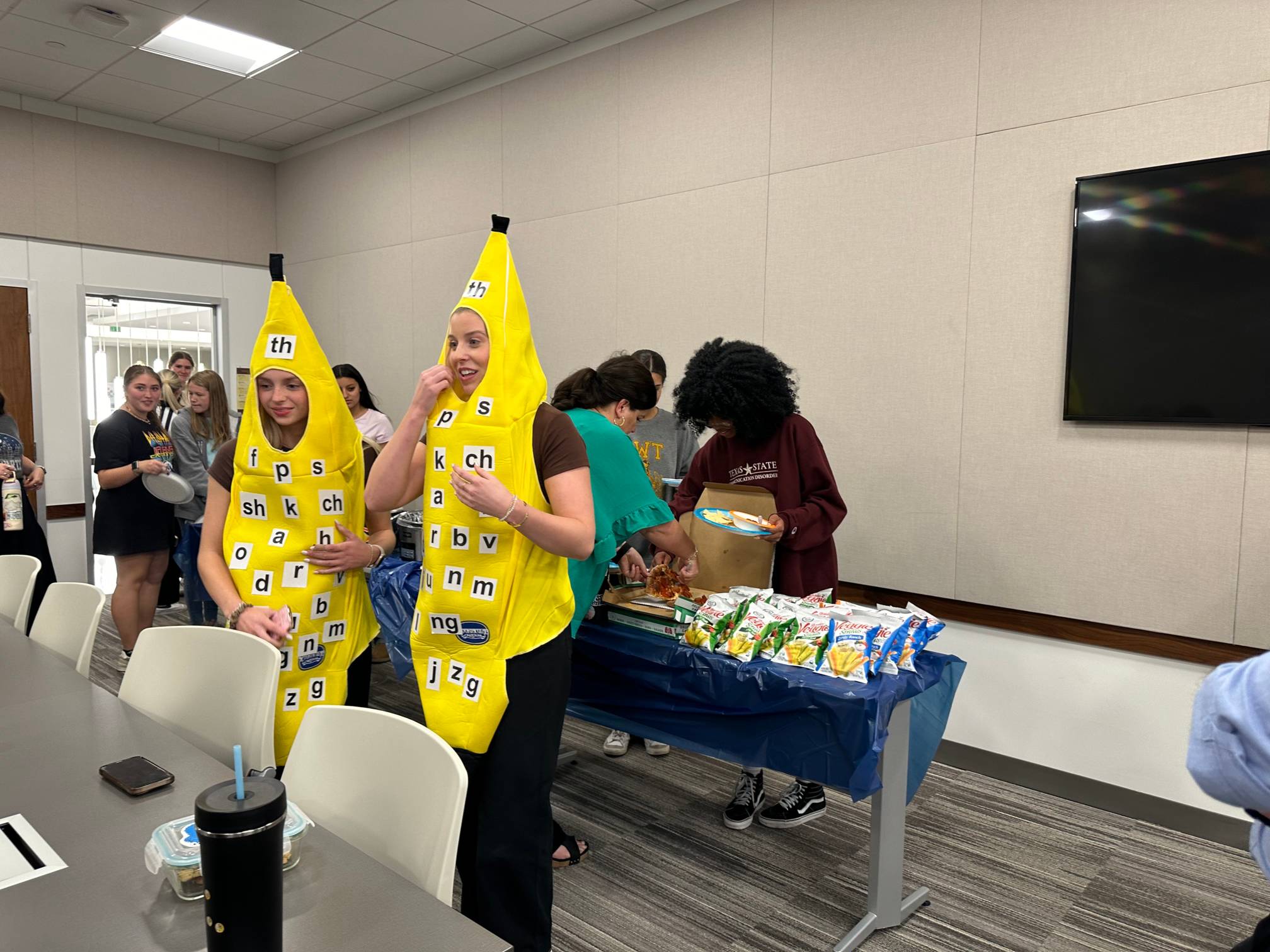 Two CDIS students dressed as "Speech Bananas"