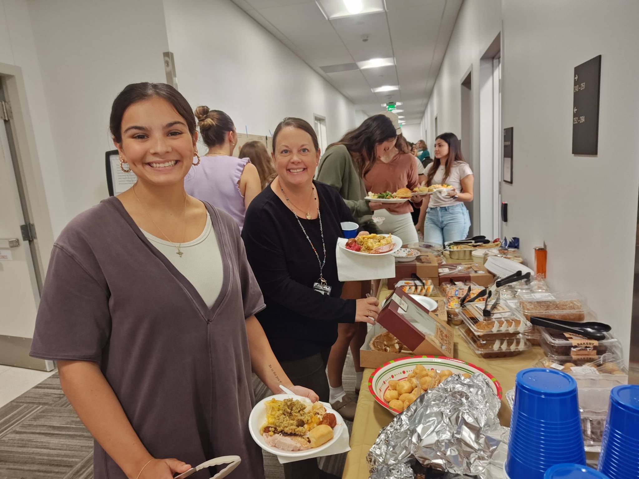 Faculty and students enjoying the potluck