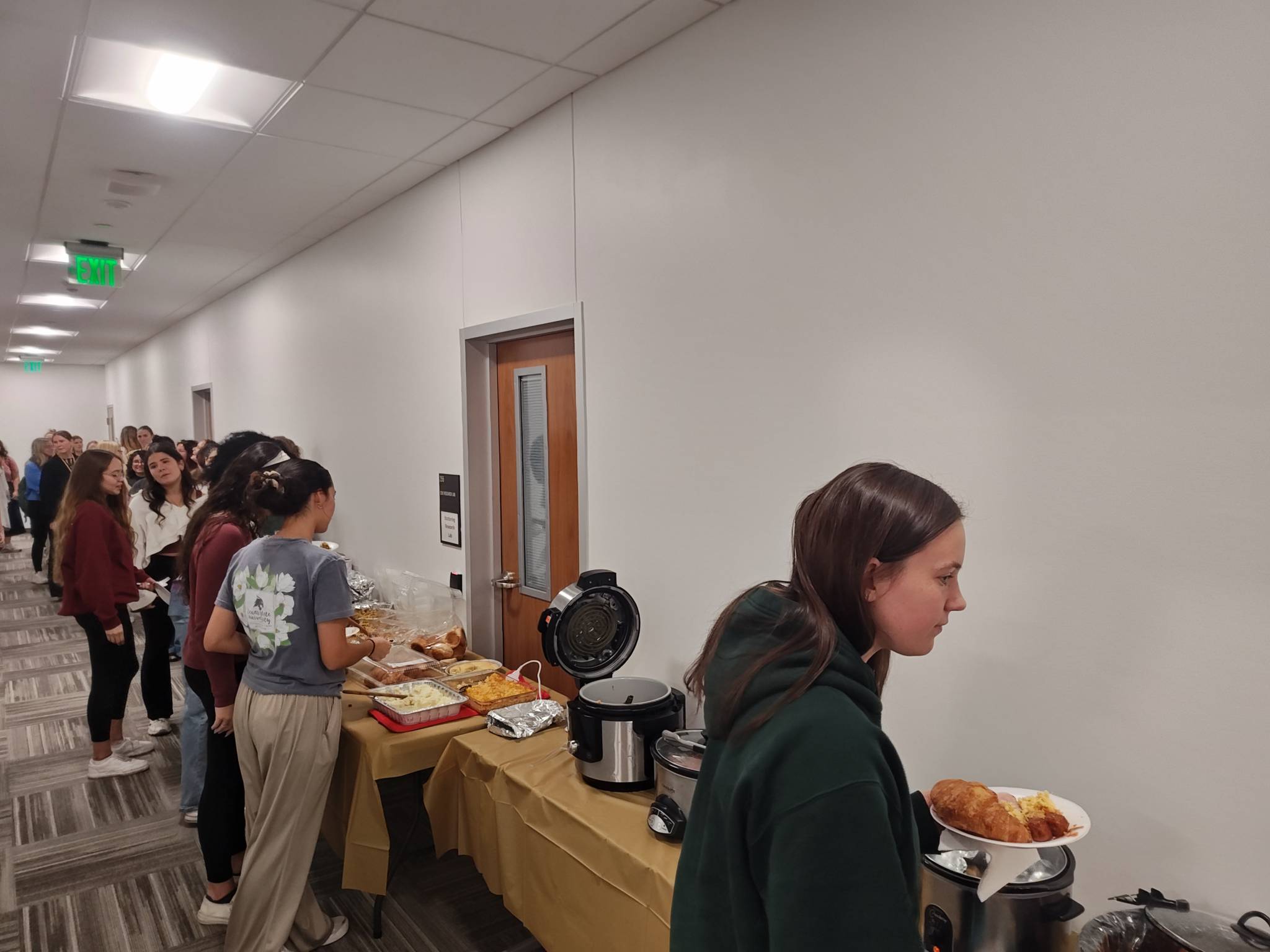Students in line to grab food.