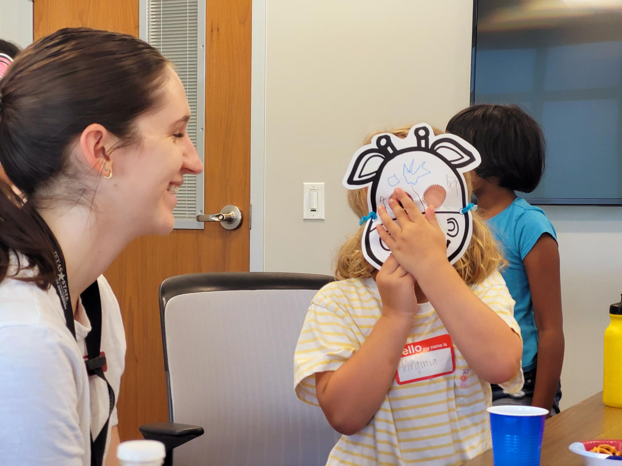 Student clinician working with a young patient.