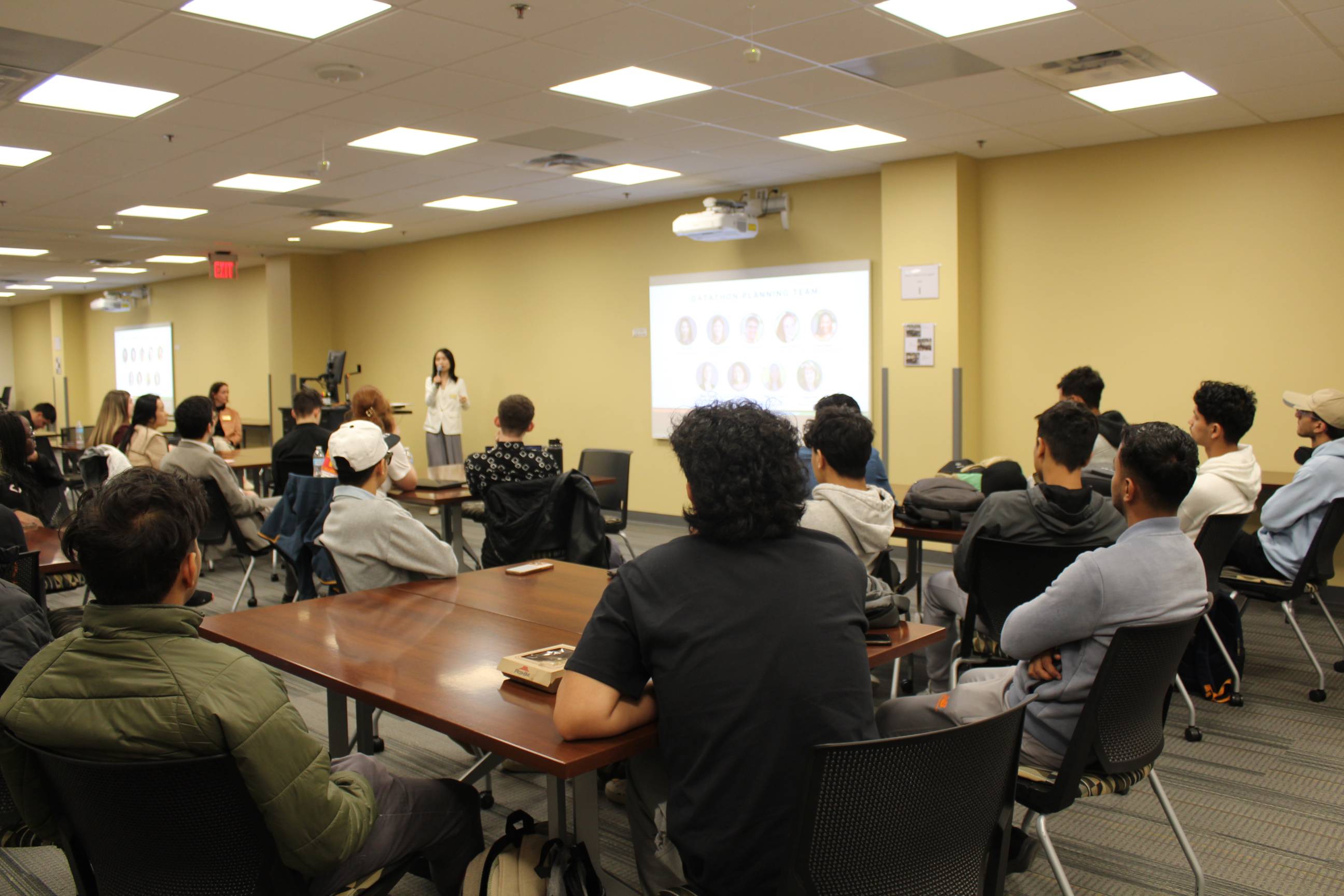 Students listening to MC at kickoff event