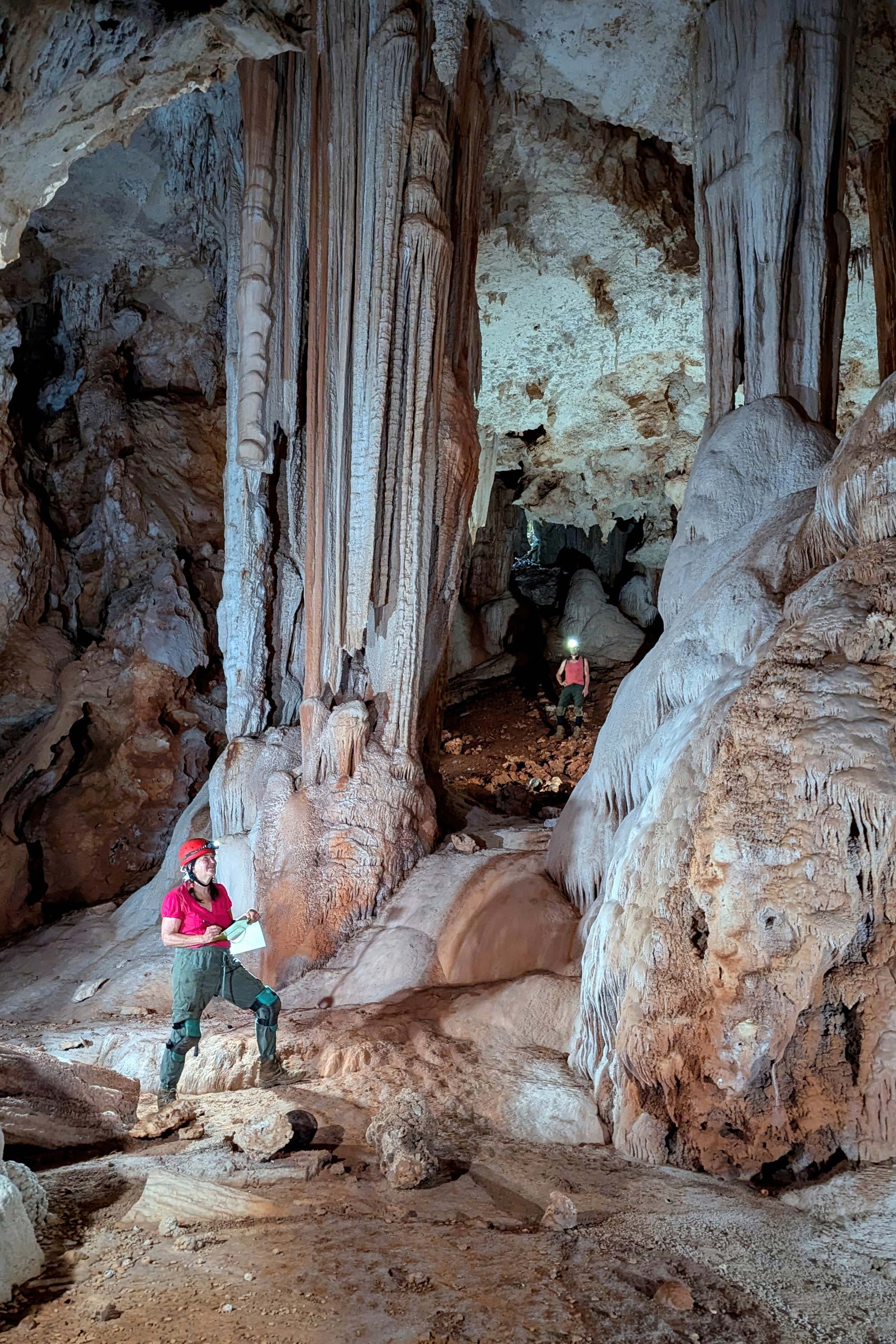 Memebers of Hutchins' team takes notes during their recent cave survey trip.