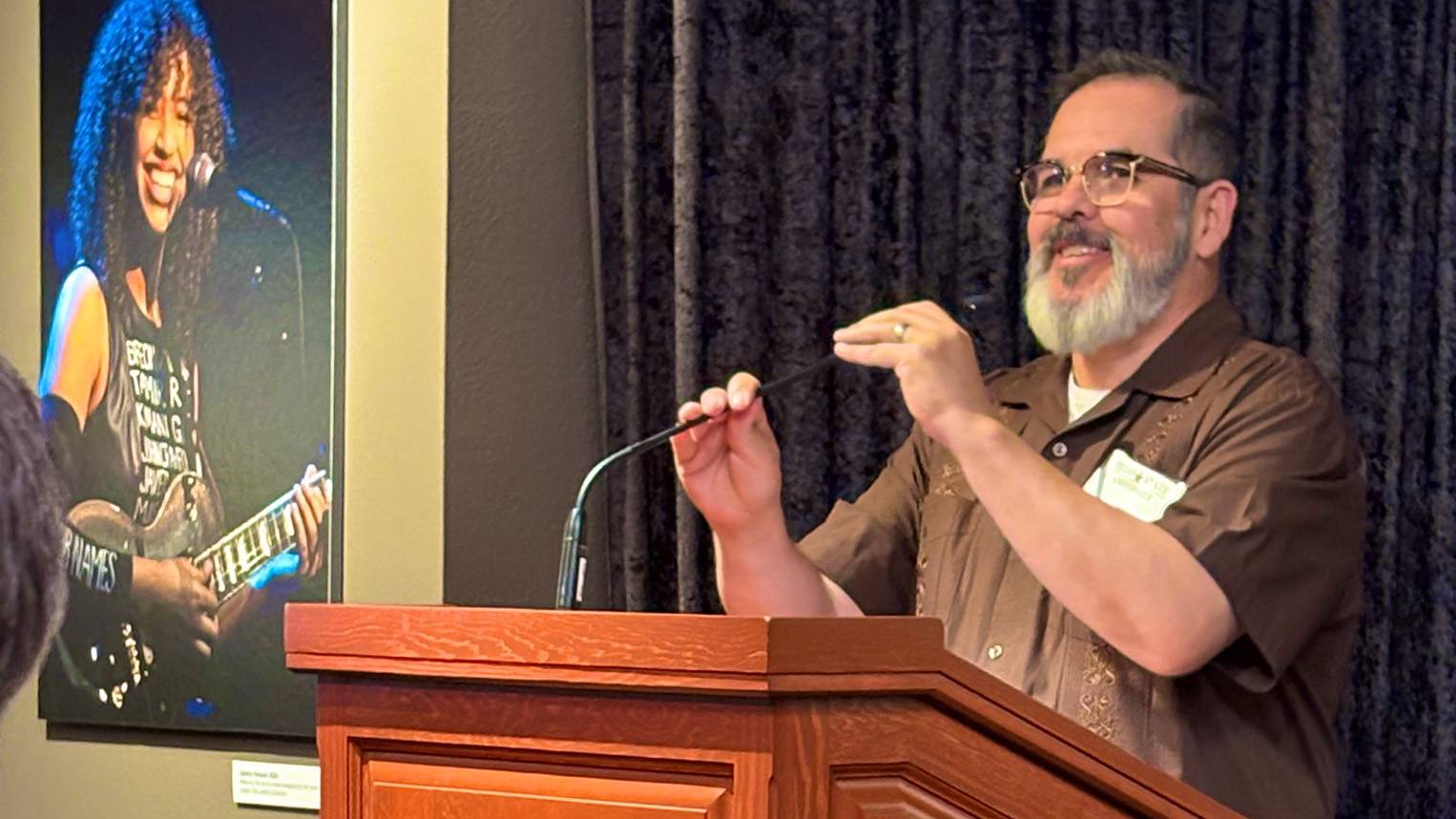 Pedro Martin speaks to the audience at the Thomas Rivera Children's Book Award luncheon.