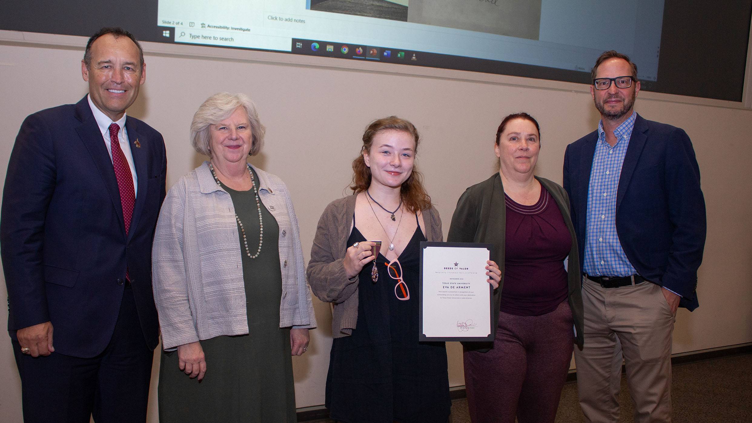 President Kelly Damphousse (left) poses for a photo with Eva De Arment (middle) and TXST staff members.