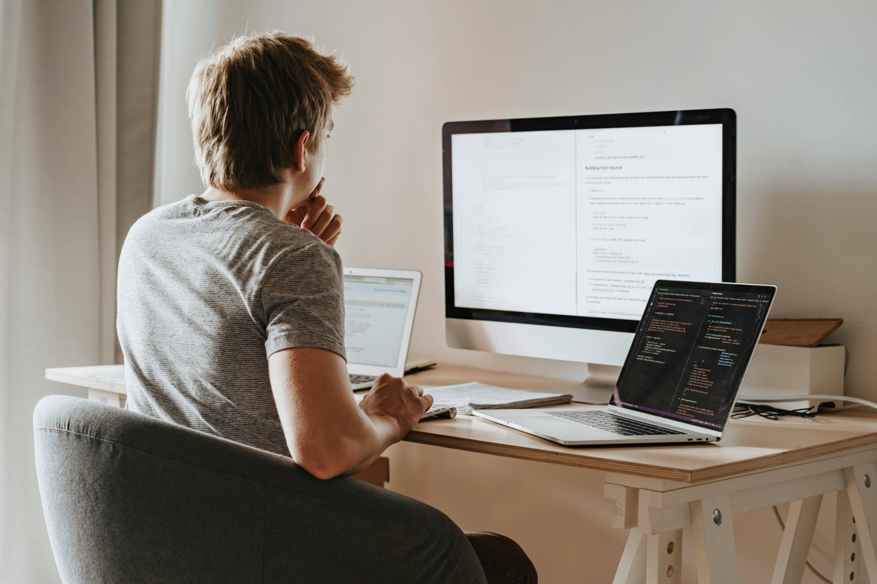 A guy looking at a computer screen